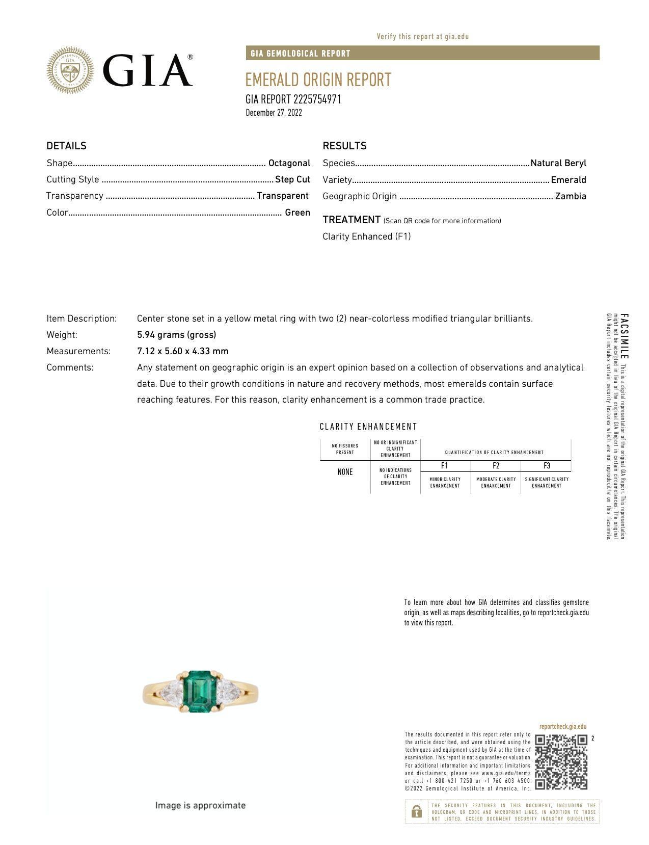 GIA-certified 1.30-carat natural minor oil emerald and trillion cut diamond 3-stone ring in 18 karat solid yellow gold. The emerald center stone features excellent clarity, transparency, and luster. The stone's impressive color and clarity is all