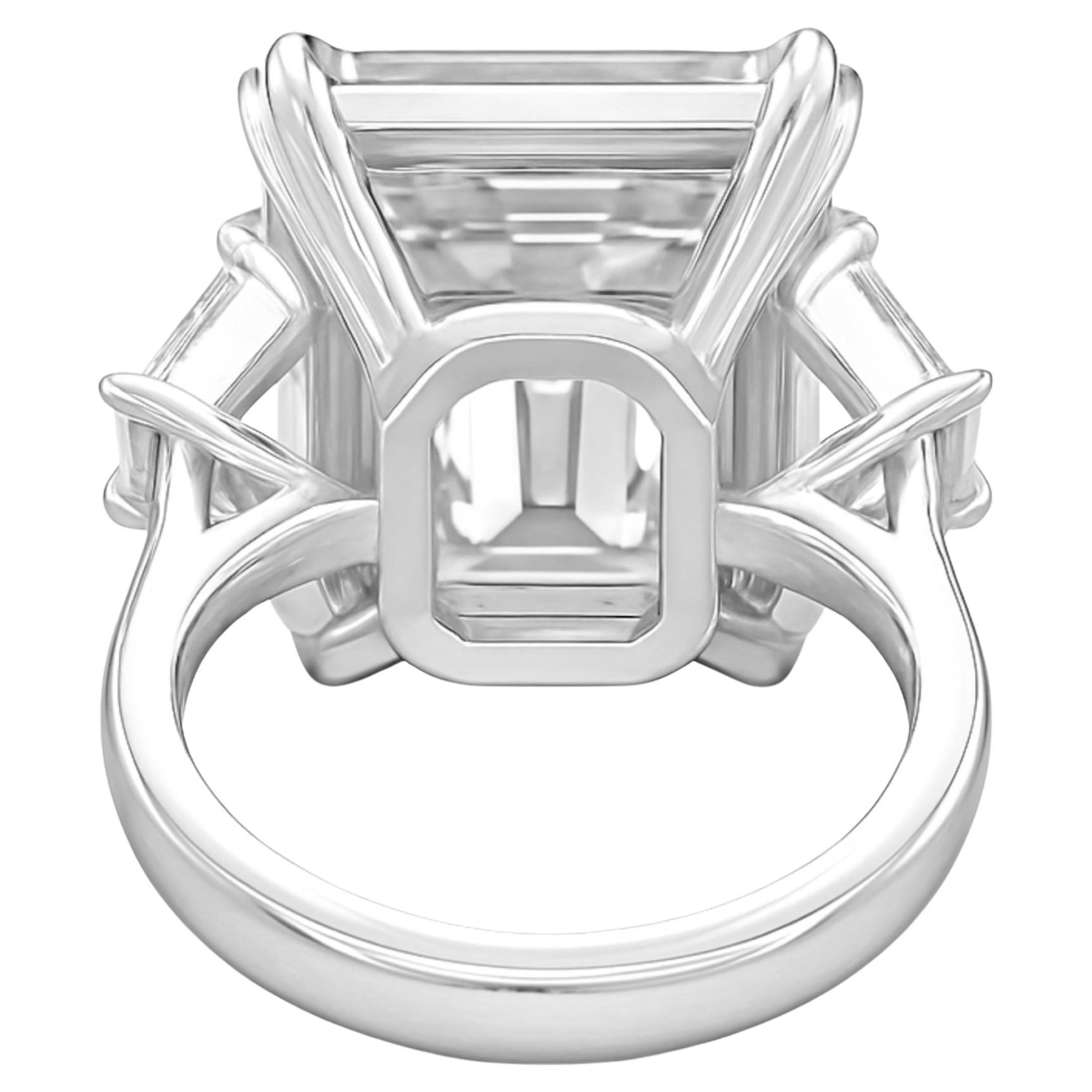 This extraordinary three stone engagement ring features a 13  carat Emerald cut diamond set in sleek platinum and accented by elegant tapered baguette diamonds. The design showcases a harmonious blend of bold geometry and timeless refinement.

The