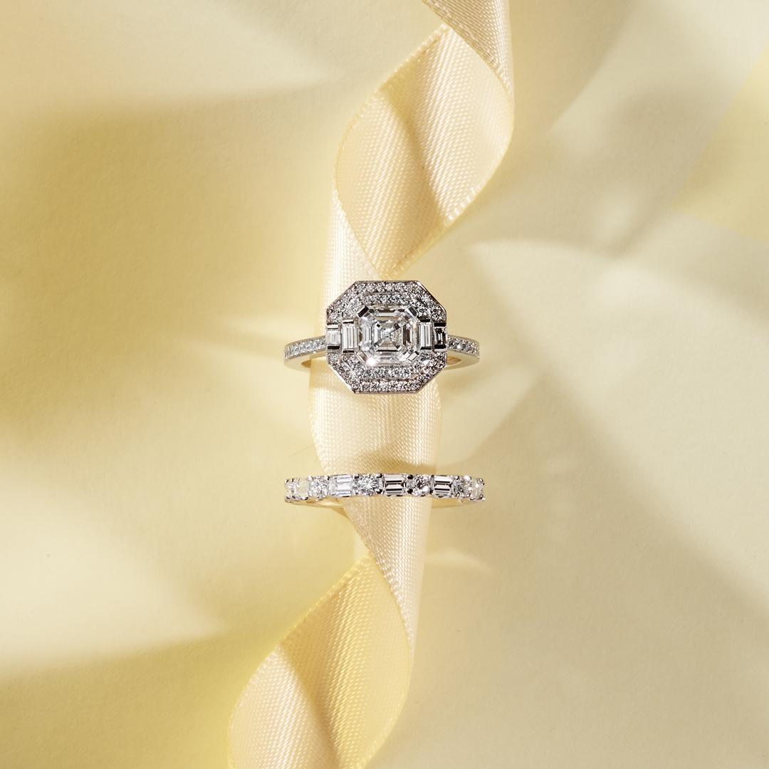 This stunning Matthew Ely engagement ring features a 1.31ct Asscher Cut Diamond (color F clarity SI1) encased between two halos of white Diamonds and finished with a Divine micro pave Diamond set platinum band (total weight 0,47ct color FG clarity