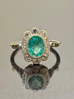GIA Certified 1.31 Carat Oval Colombian Emerald Halo Diamond Engagement Ring