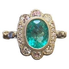 GIA Certified 1.31 Carat Oval Colombian Emerald Halo Diamond Engagement Ring