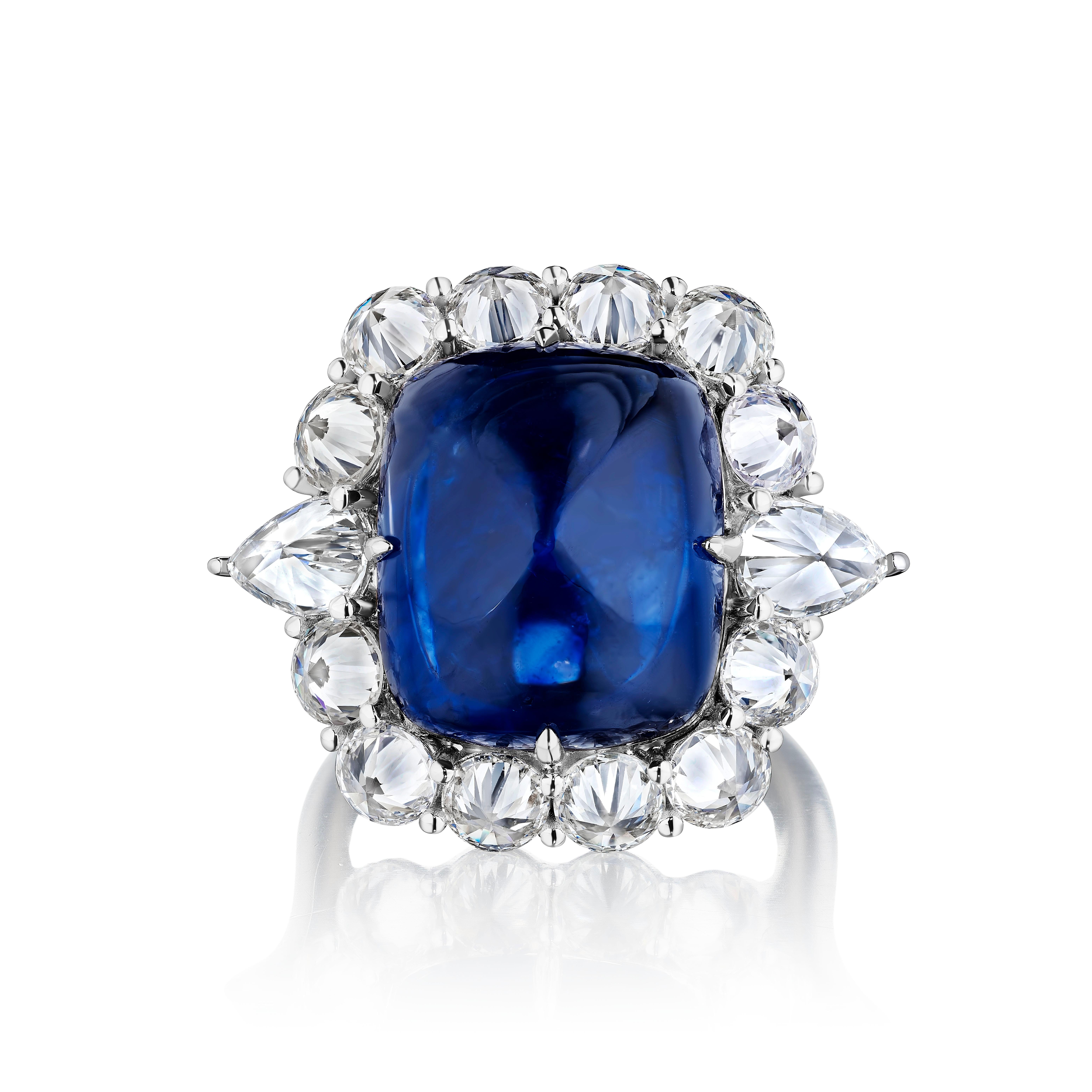 Unique Sapphire Ring

Sugarloaf Sapphire weighing 13.15 Carats with GIA Certificate, surrounded by reverse-set Round and Pear Shape Diamonds weighing 4.02 Carats.
Pear Shape Diamonds weighing 1.0 Carats are F color, VS2 clarity, certified by