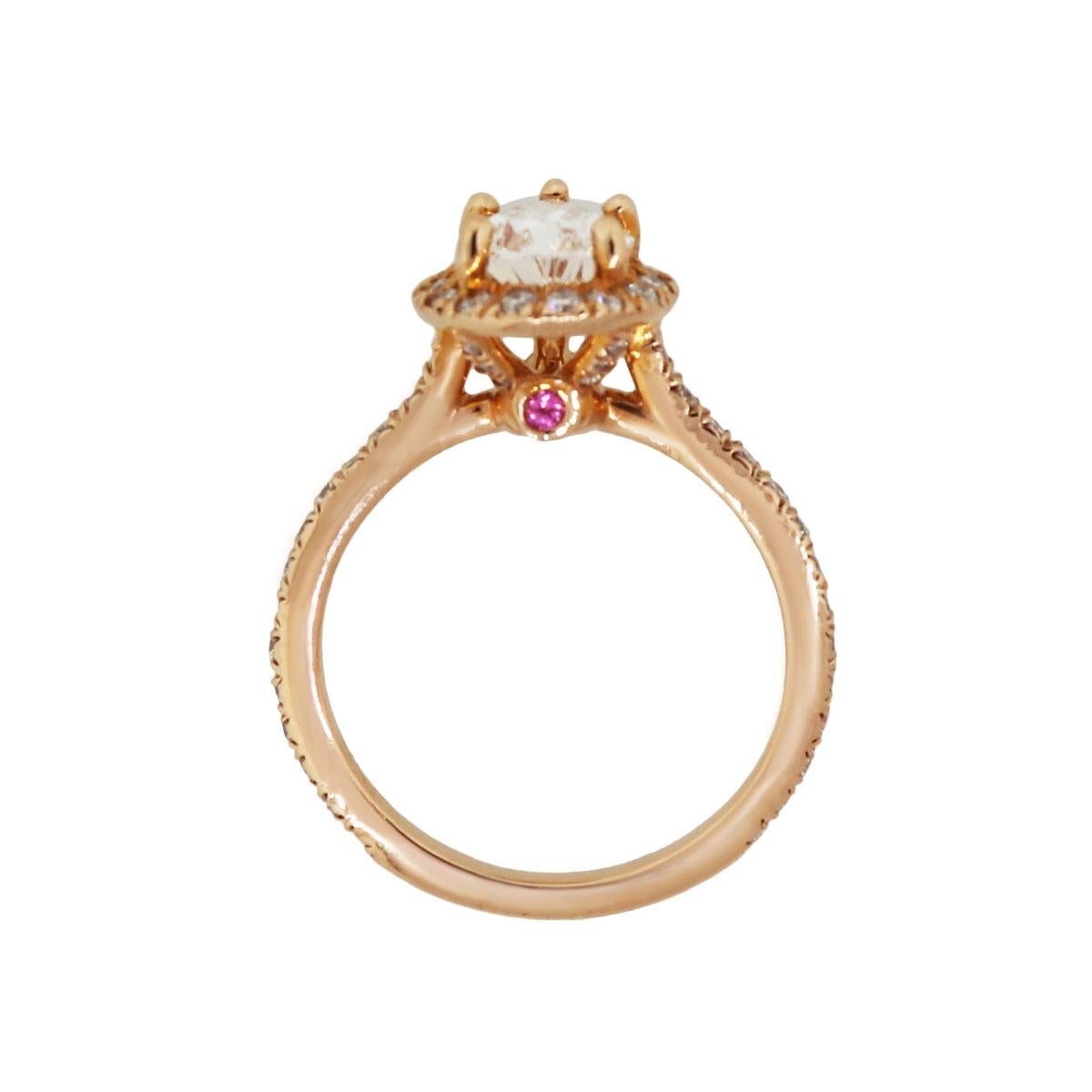 Material: 14k rose gold
Center Diamond Details: GIA certified 1.31ct pear shape diamond. Diamond is G in color and VVS1 in clarity. GIA cert. #2237572429
Adjacent Diamond Details: Approximately 0.58ctw of round brilliant diamonds. Diamonds are G/H