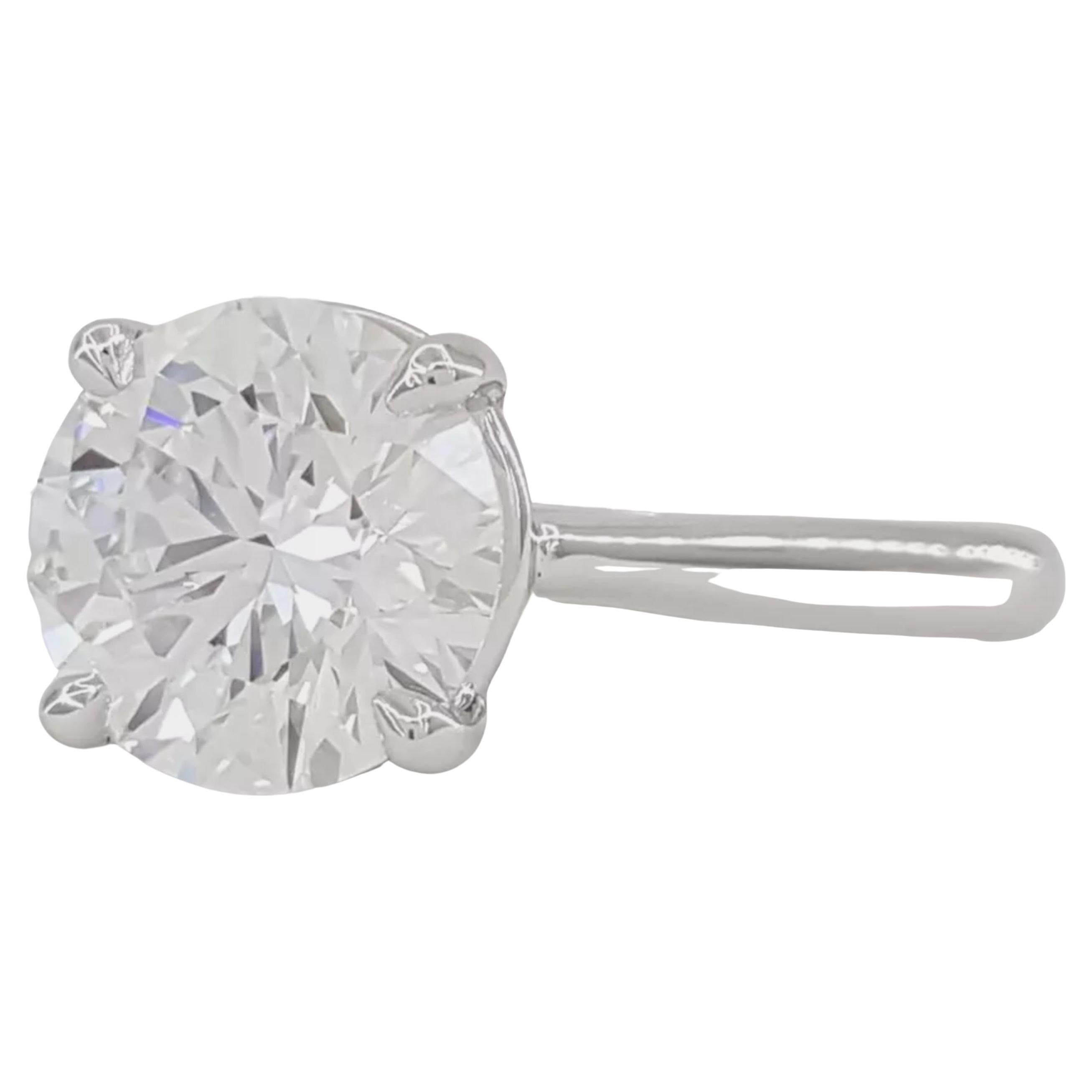 Exquisite 1.32 ct Round Brilliant Cut Diamond Platinum Solitaire Engagement Ring

This stunning platinum solitaire engagement ring features a dazzling 1.32 ct natural Round Brilliant Cut diamond, expertly crafted for maximum brilliance. The diamond