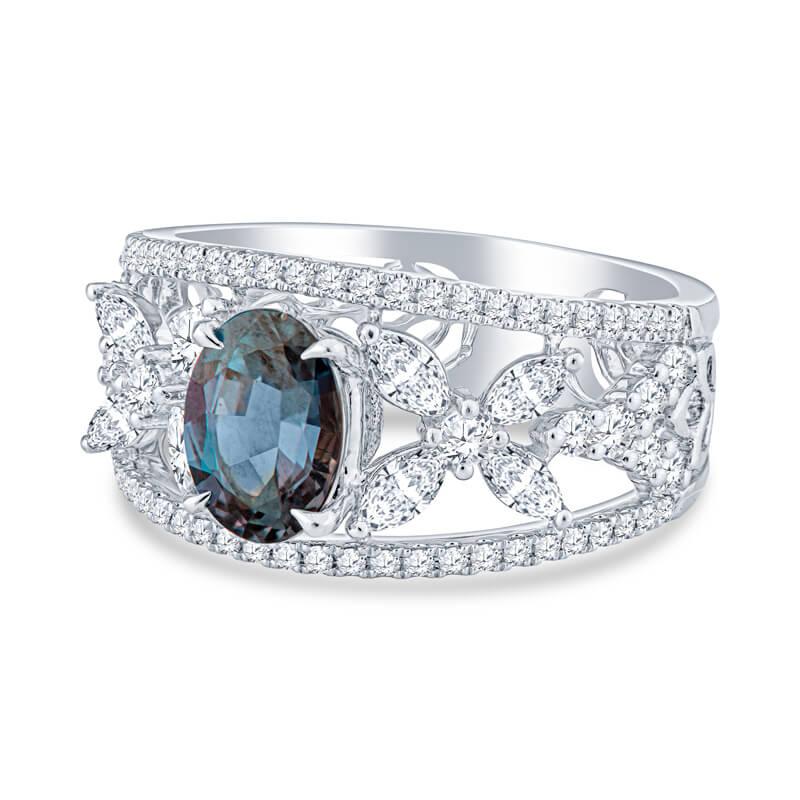 This beautiful and unique ring features a 1.33 carat Brazilian Oval Cut natural color changing GIA certified Alexandrite. This beautiful and rare gemstone changes color from a bluish green to a raspberry color. It is accented by a total weight of