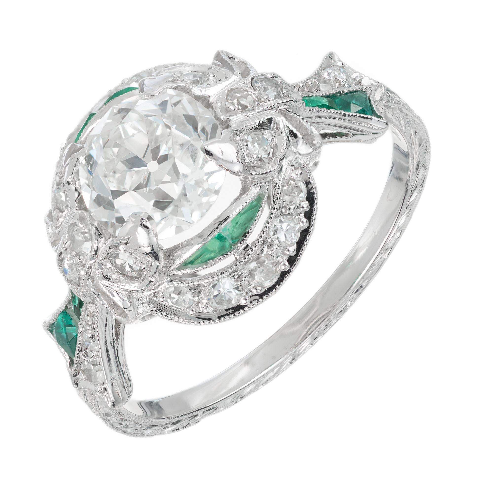 Original 1900's handmade diamond and emerald platinum engagement ring. GIA certified Old European cut center stone in a hand engraved platinum setting with 22 bead set old cut diamonds and 8 French emerald accents. The emeralds are French cut and