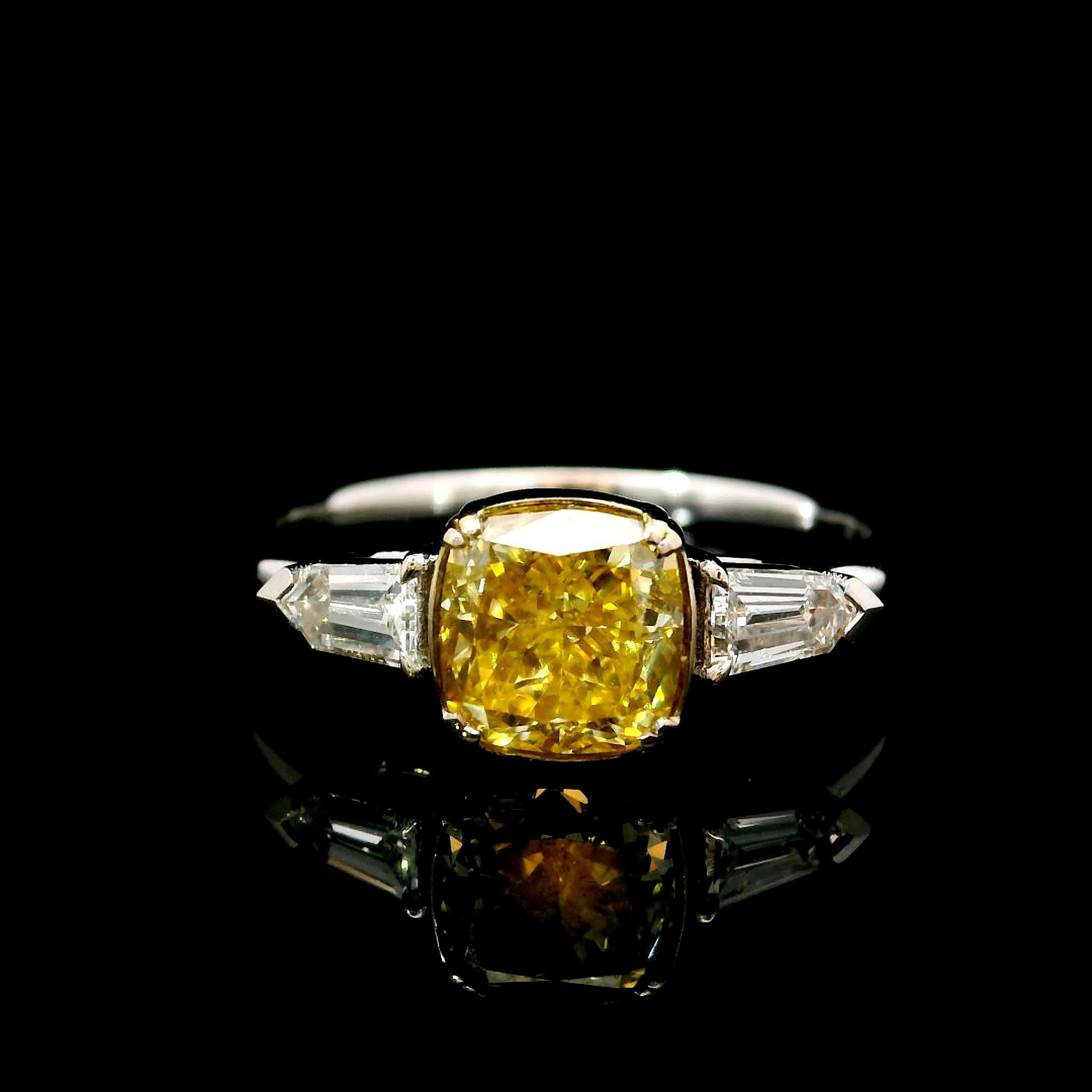 18kt white gold ring with diamonds
  
  Gold colour & karat: White gold 18kt
  Weight: 2.69 grams
  
  Set with-
  Stone type: Diamonds
  Shape: Cushion
  Carat: 1.33
  Colour: Fancy Light Yellow  
  Clarity: VS1
  
  Surrounding Stones: Diamonds
