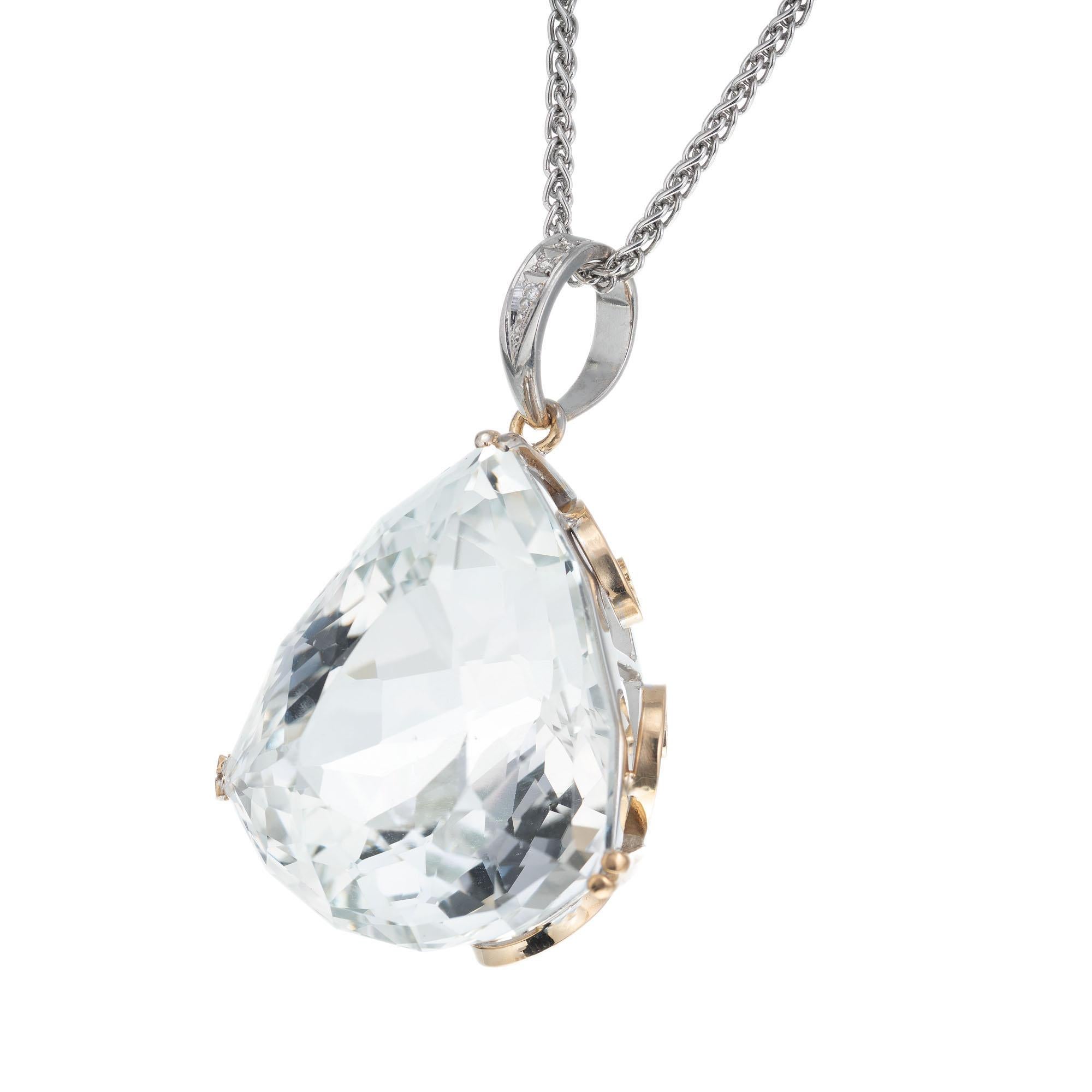GIA certified large 133.28 carat natural topaz modified pear shape pendant with a diamond bail. Handmade 18k yellow and white gold setting with a 17 inch white gold chain.  

1 pear brilliant shape topaz VS, approx. 133.28cts GIA Certificate #