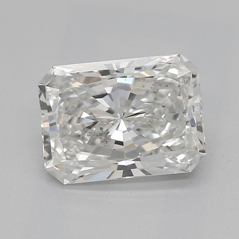 Handcrafted in New York, this stunning diamond ring features a captivating radiant G SI2 1.34 center stone, exquisitely prong set to enhance its brilliance from every angle. The luxurious band, crafted from platinum , is finished with a high polish