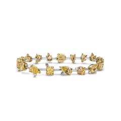 GIA Certified 13.41 Carat Fancy Intense Yellow Diamond Bracelet, VVS1–SI1