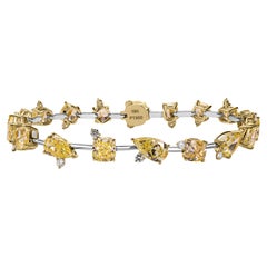 GIA Certified 13.41 Carat Fancy Intense Yellow Diamond Bracelet, VVS1–SI1