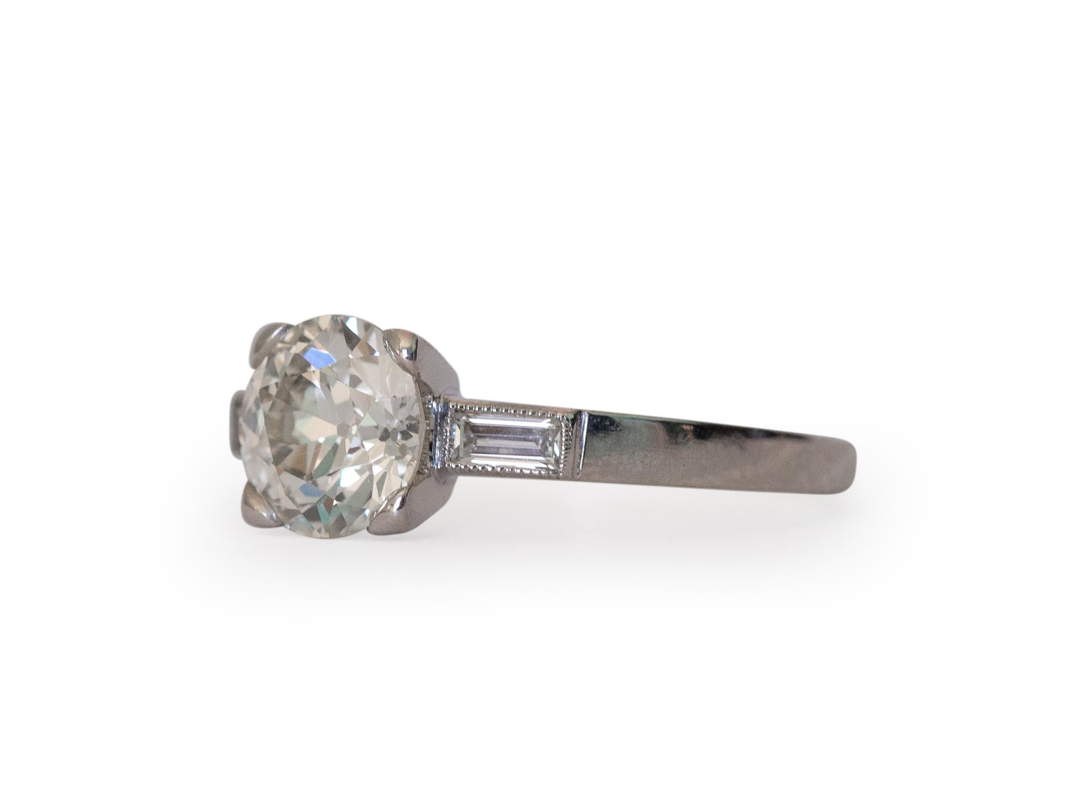 Ring Size: 7
Metal Type: Platinum  [Hallmarked, and Tested]
Weight:  3.8 grams

Center Diamond Details:
GIA REPORT #: 2215047418
Weight: 1.35 carat
Cut: Old European Brilliant
Color: K
Clarity: VS1

Side Diamond Details:
Weight: .20 carat, total