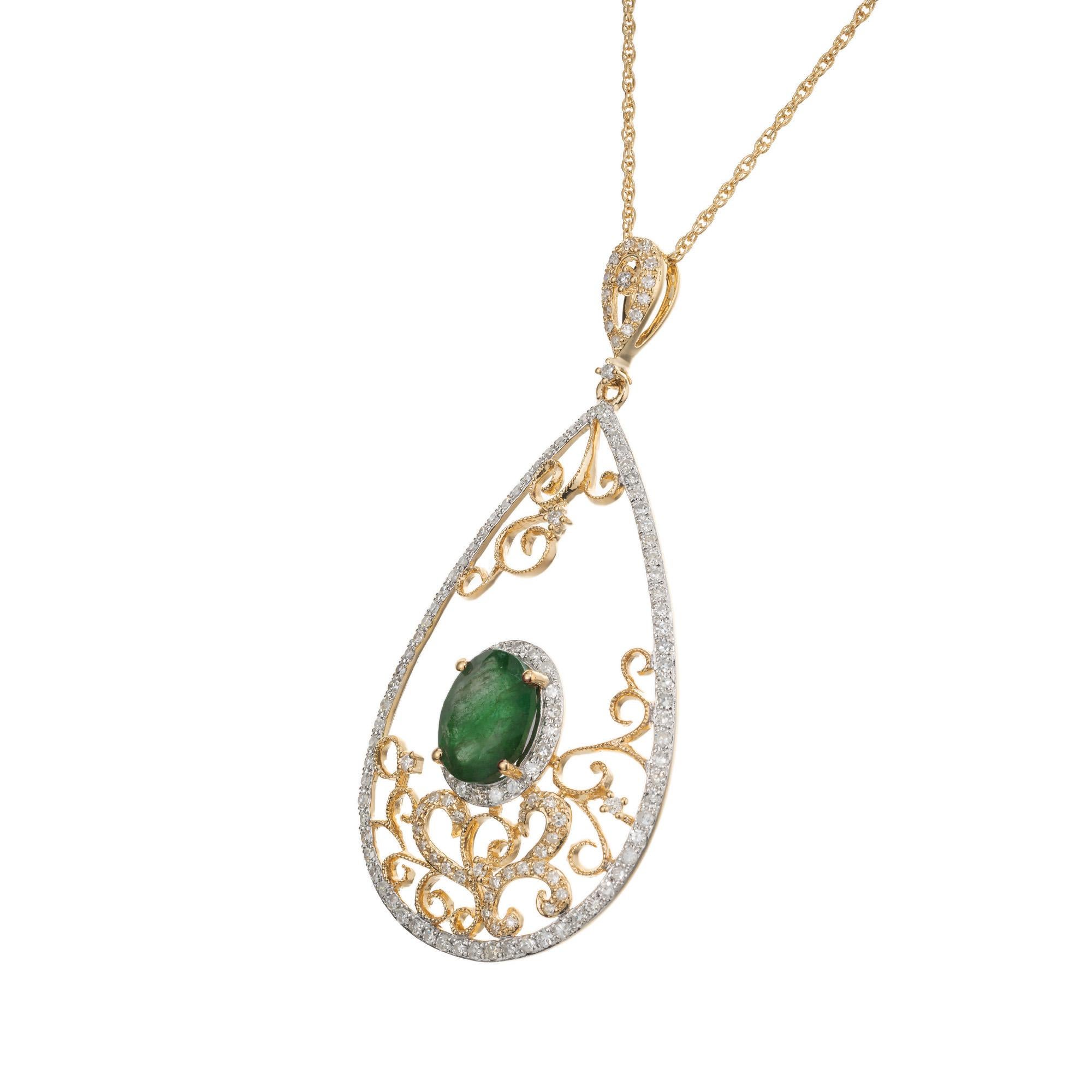 Emerald and diamond Open filigree pendant necklace. 1.35ct oval bright green center emerald set in an open work filigree design with 140 round single cut accent diamonds including a halo around the emerald. GIA certified low heat F1 clarity