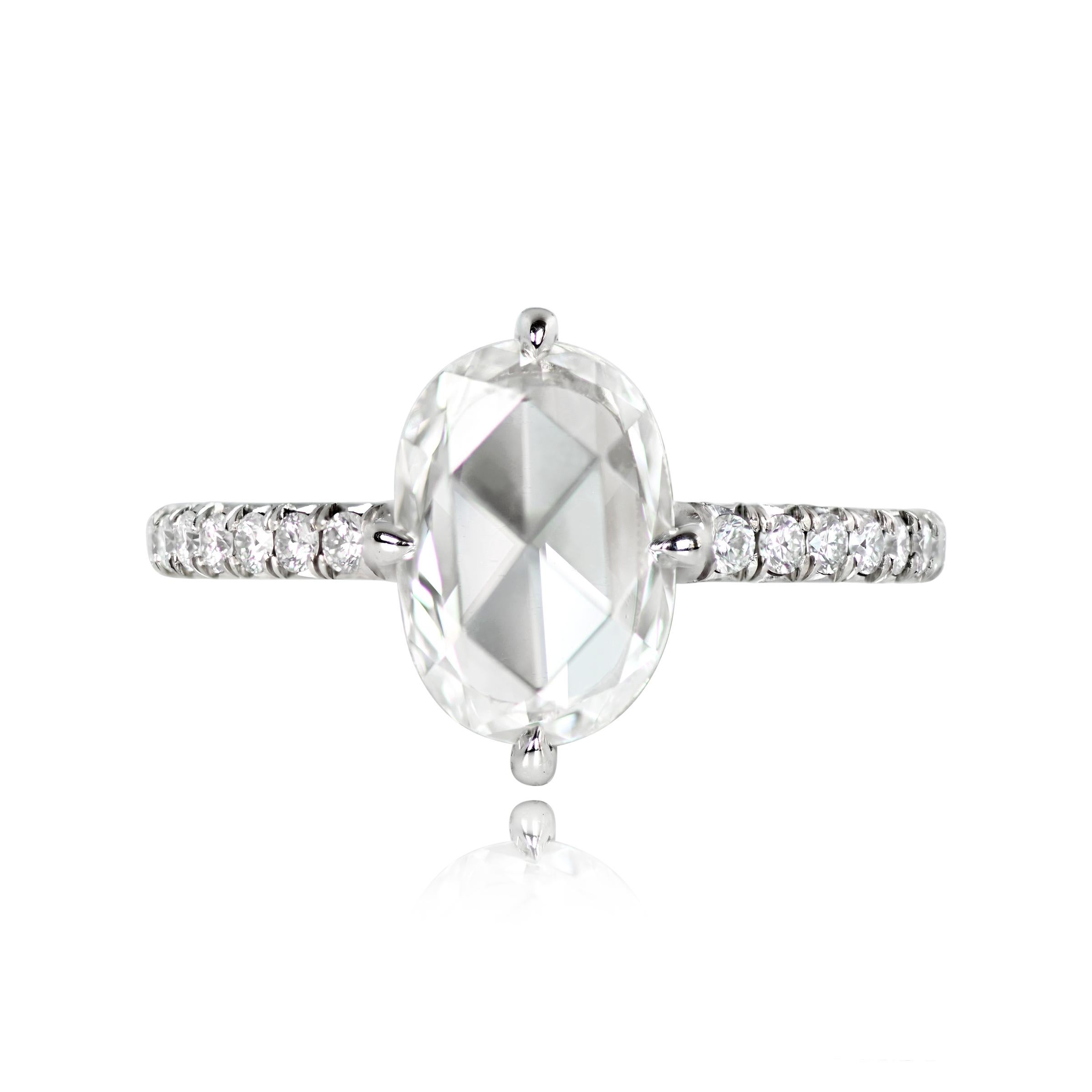 Platinum diamond solitaire ring with GIA-certified 1.35-carat oval rose cut center diamond in prongs. Micro-pave round brilliant cut diamonds adorn the shoulders and shank. Additional round brilliant cut diamonds are set in the under-gallery. E