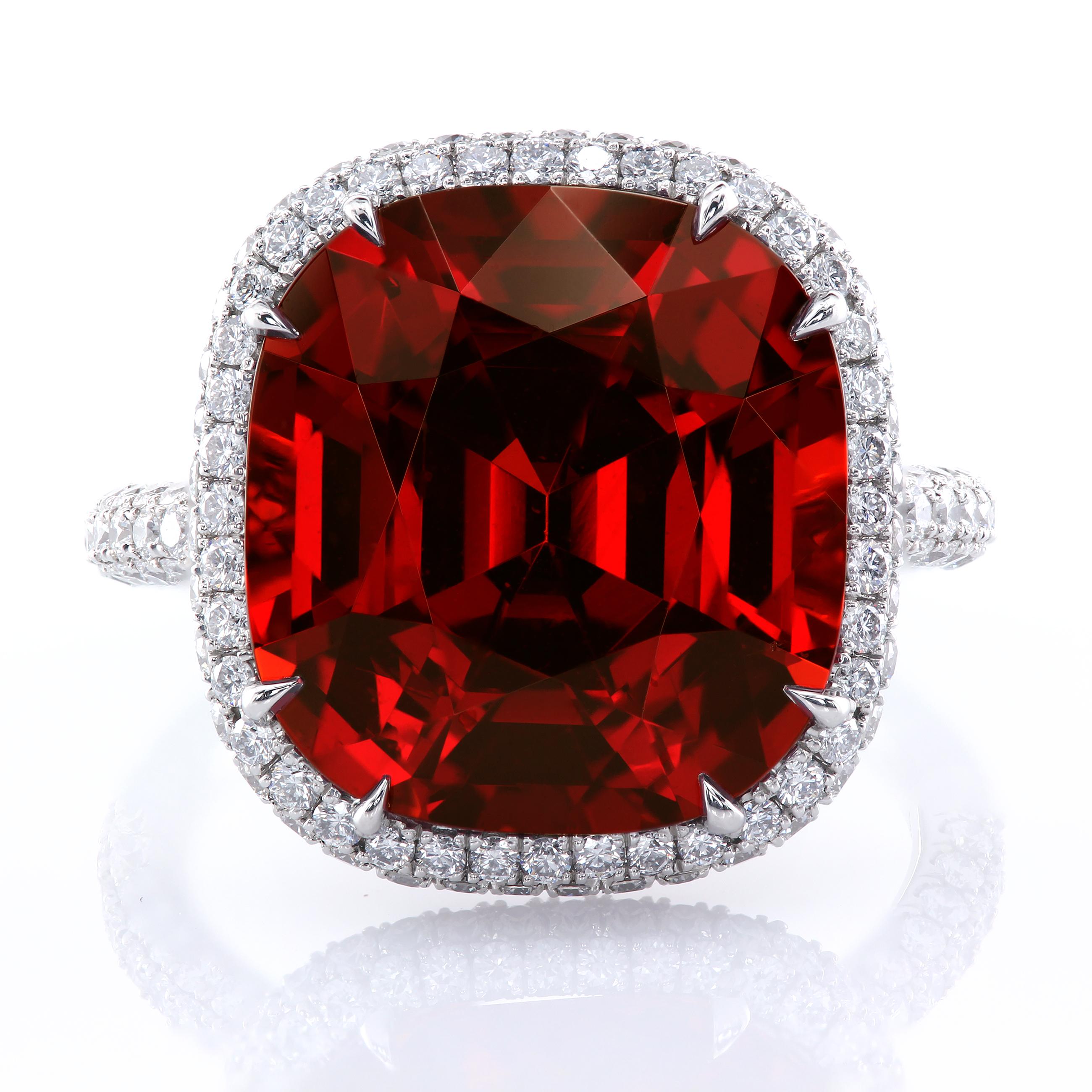 Bohemian sangria-colored 13.63-carat garnet in a multi-row statement ring. The intricate micro pave details are encrusting the ring's basket, halo, and shank. The rare crystal clear Spessartine garnet is certified by the GIA 6173149396. The ring is