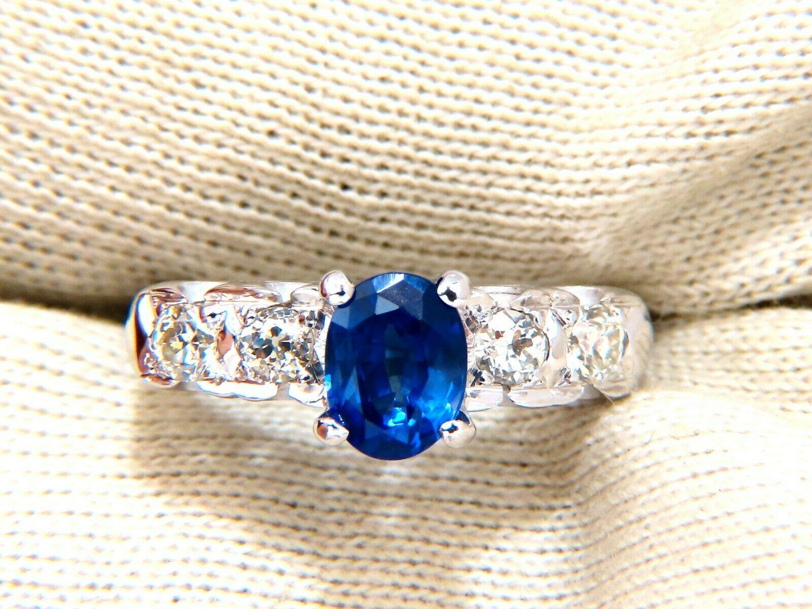 GIA Certified: 1.36ct.

Natural blue sapphire ring.

Full cut brilliant oval cut Clean clarity Transparent and vibrant

top Bright Gem Royal Blue

7.27 X 5.50 x 3.79mm

1.37ct. Natural Diamonds Rounds, full cut G-color vs-2 clarity

14kt. White gold