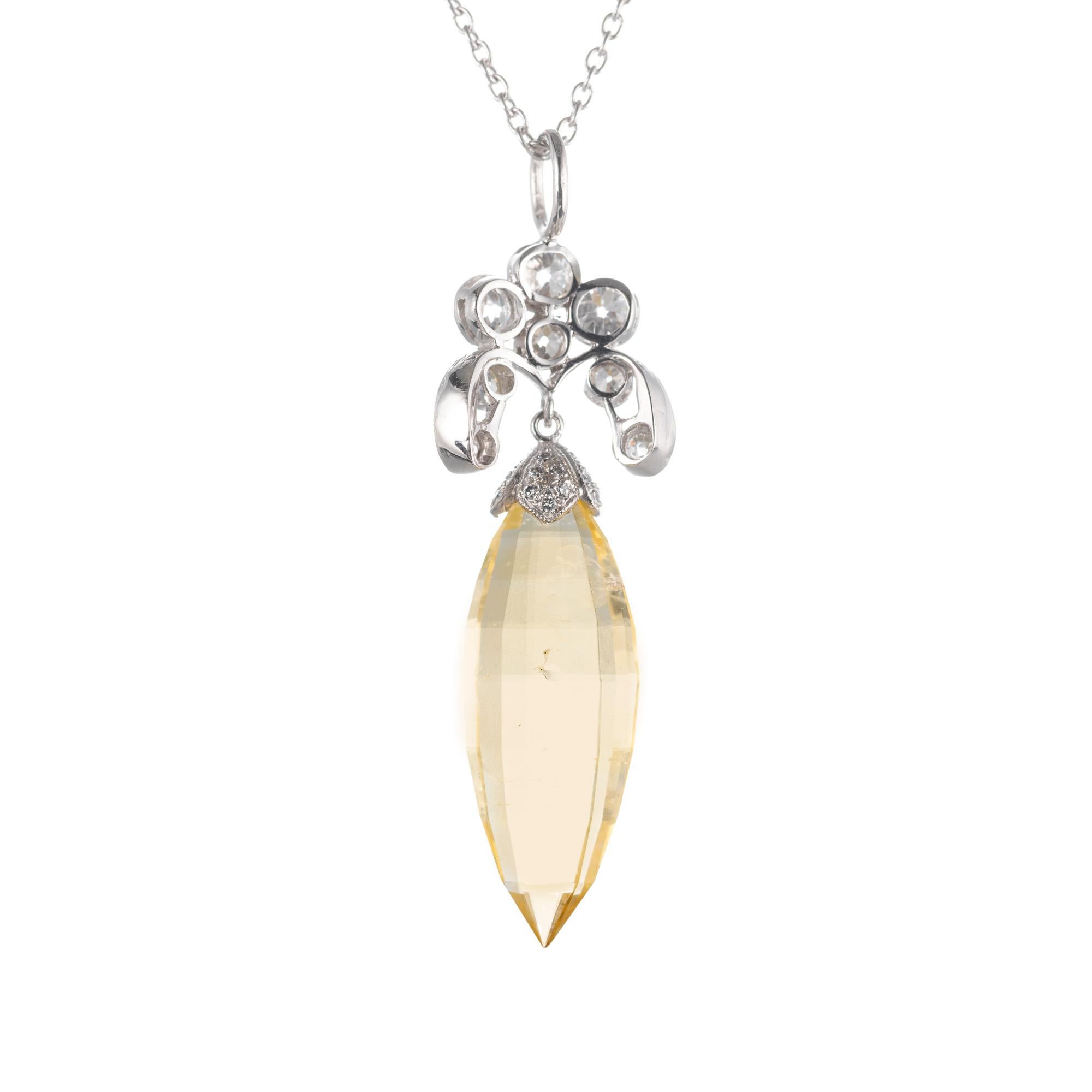 Art Deco yellow marquise briolette sapphire and diamond necklace pendant. Gia certified natural no heat sapphire with 30 accent diamonds on a platinum chain.  circa 1920's.

1 marquise briolette I natural inclusions yellow sapphire, Approximate