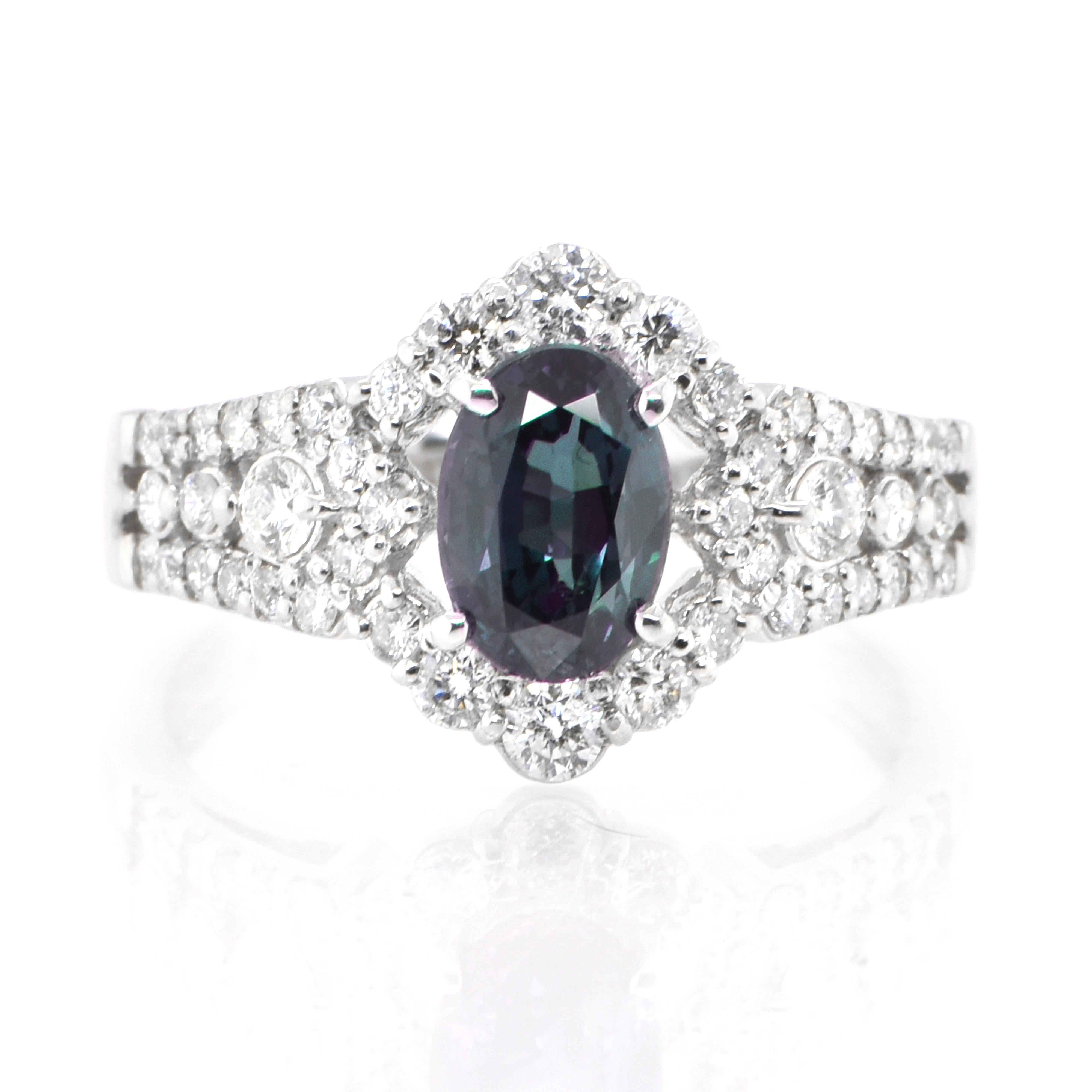 A gorgeous ring featuring a GIA Certified 1.38 Carat, Natural Brazilian Alexandrite and 0.53 Carats of Diamond Accents set in Platinum. Alexandrites produce a natural color-change phenomenon as they exhibit a Bluish Green Color under Fluorescent