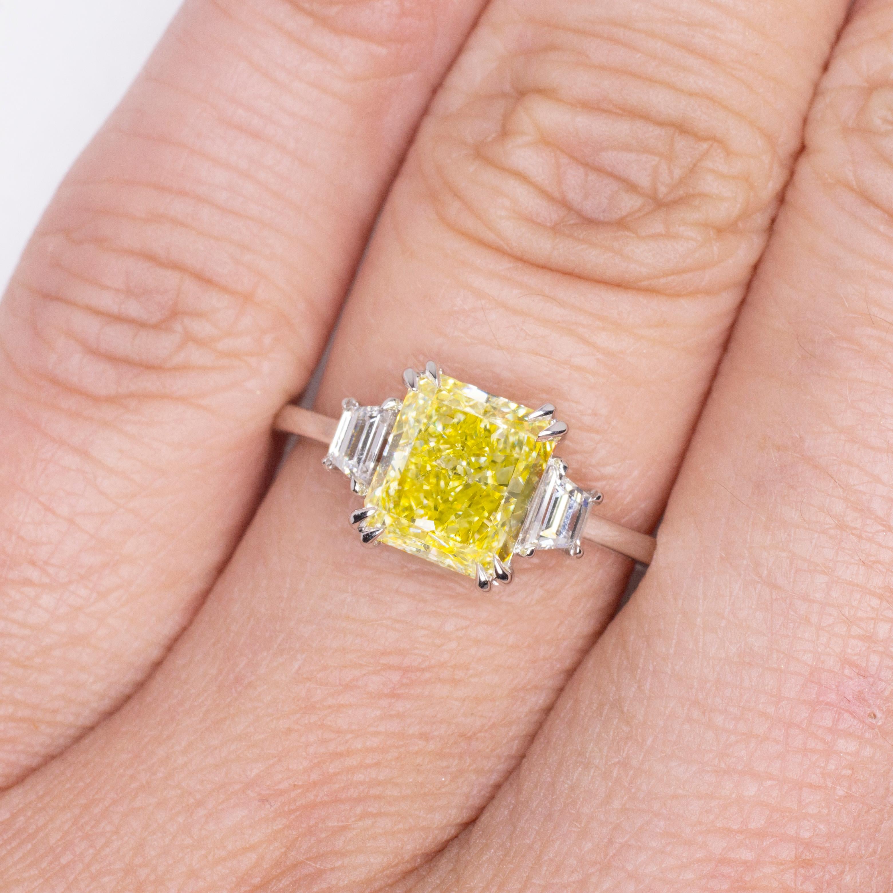 Contemporary GIA Certified 1.38 Carat Fancy Yellow Radiant Cut Diamond 18K White Gold Ring For Sale