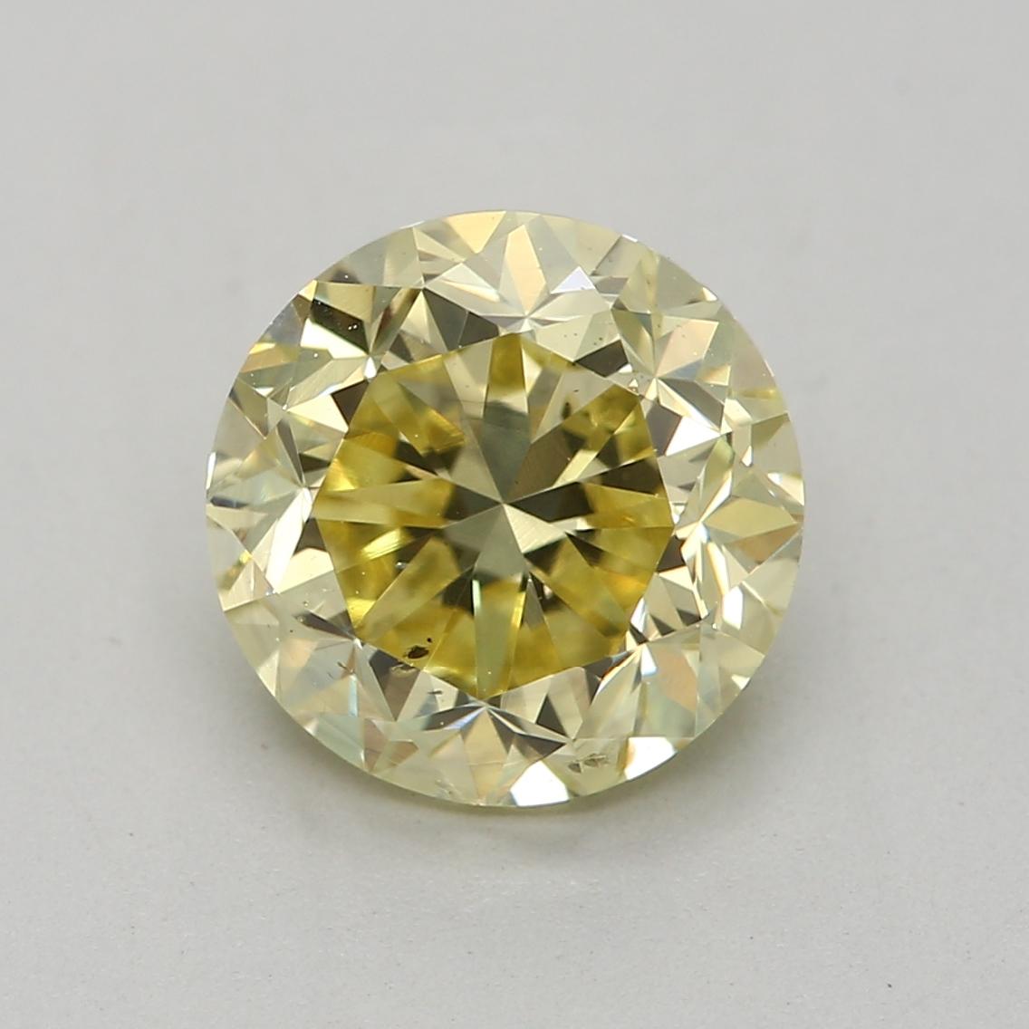 Certificate: GIA 
Report Number: 2467251769
Shape And Cut: Round
Carat Weight: 1.38 carat
Measurements: 6.74 x 6.76 x 4.57 mm
Color Grade: Fancy Yellow

FEATURES OF THE DIAMOND:

This fancy yellow diamond is a vibrant and stunning diamond that