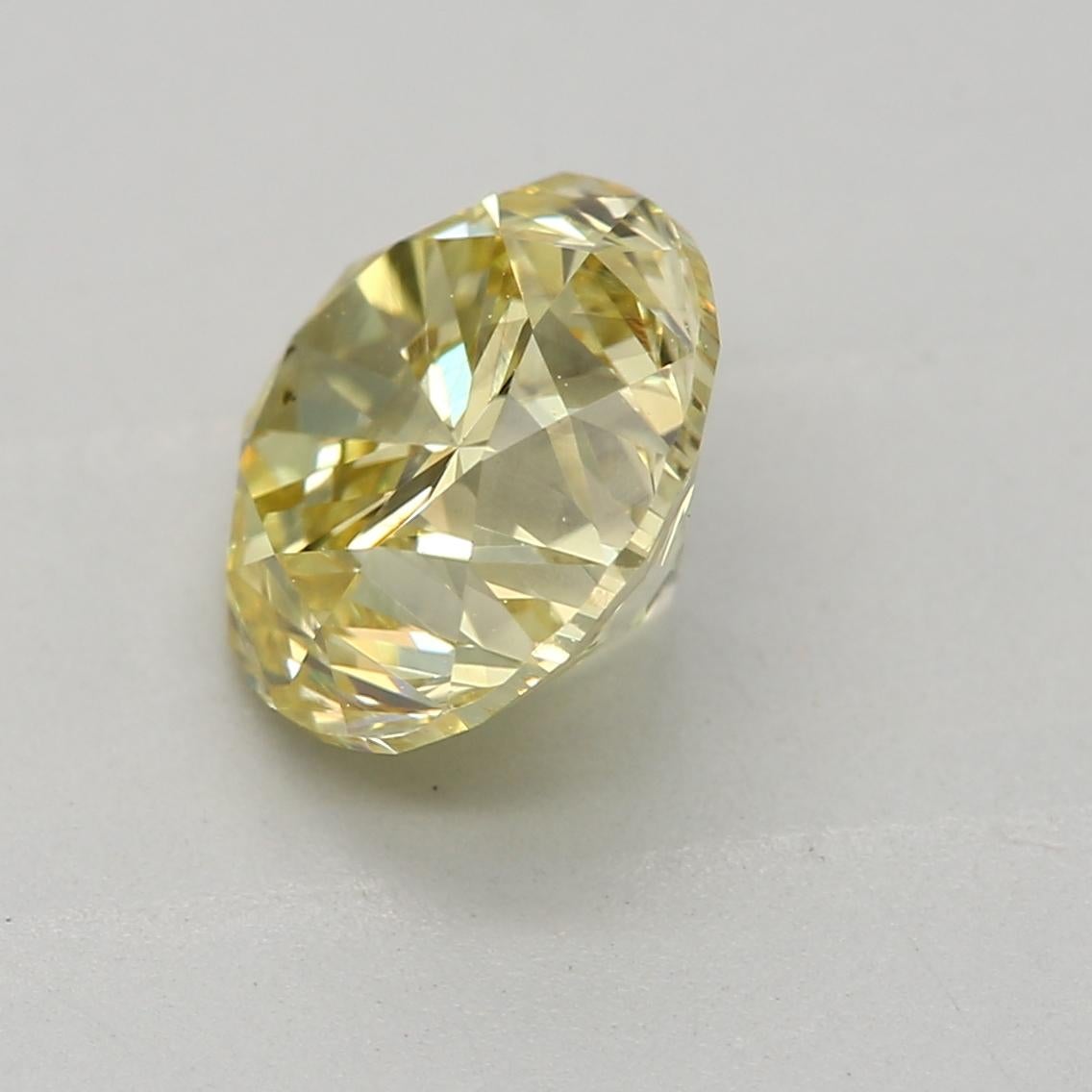 Round Cut GIA Certified 1.38 Carat Fancy Yellow SI2 Clarity Diamond For Sale