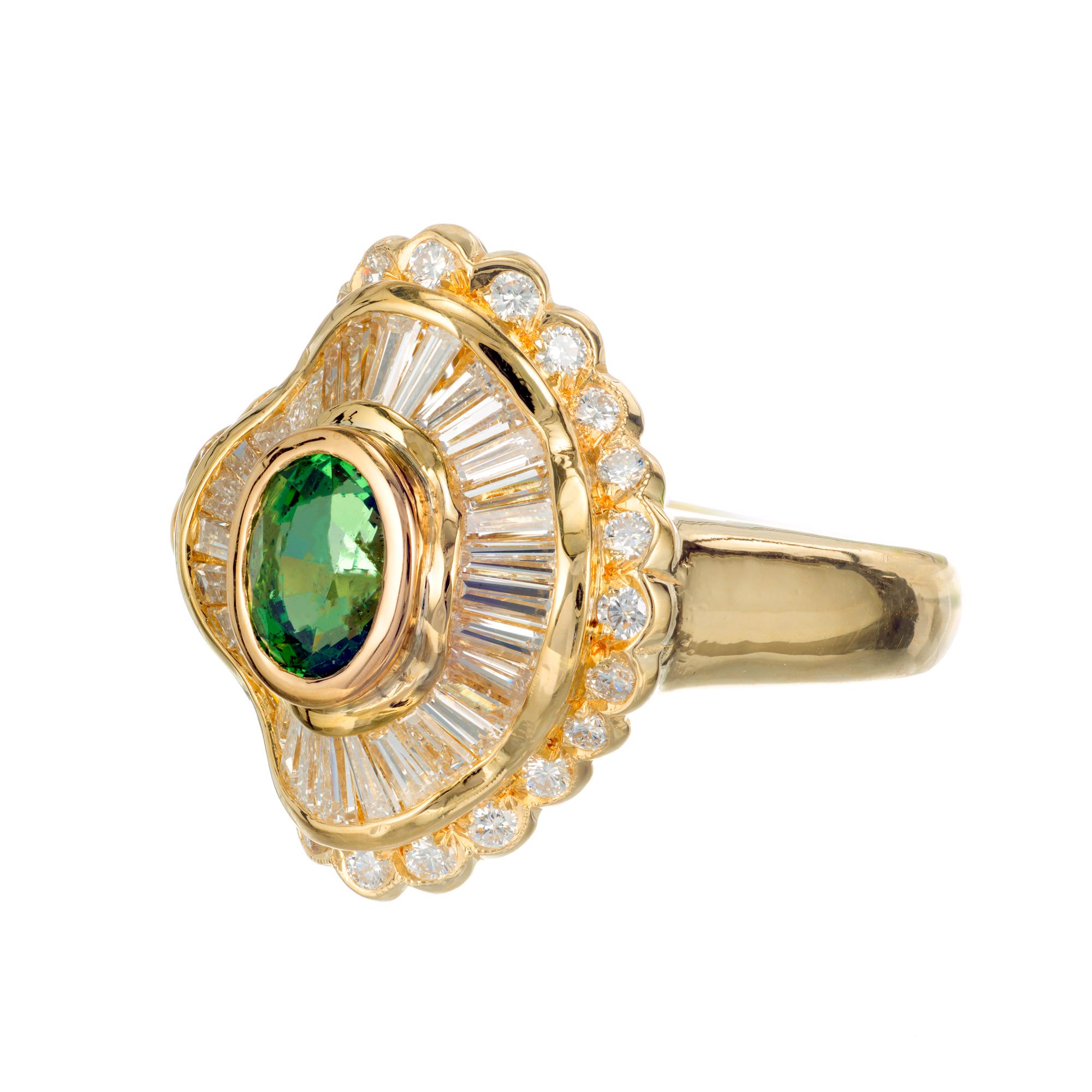1970's green tsavorite and diamond cocktail ring. GIA certified oval green garnet center stone, set in 18k yellow gold setting with round and baguette accent diamonds om princess style double halo design. 

1 oval green tsavorite garnet, Approximate