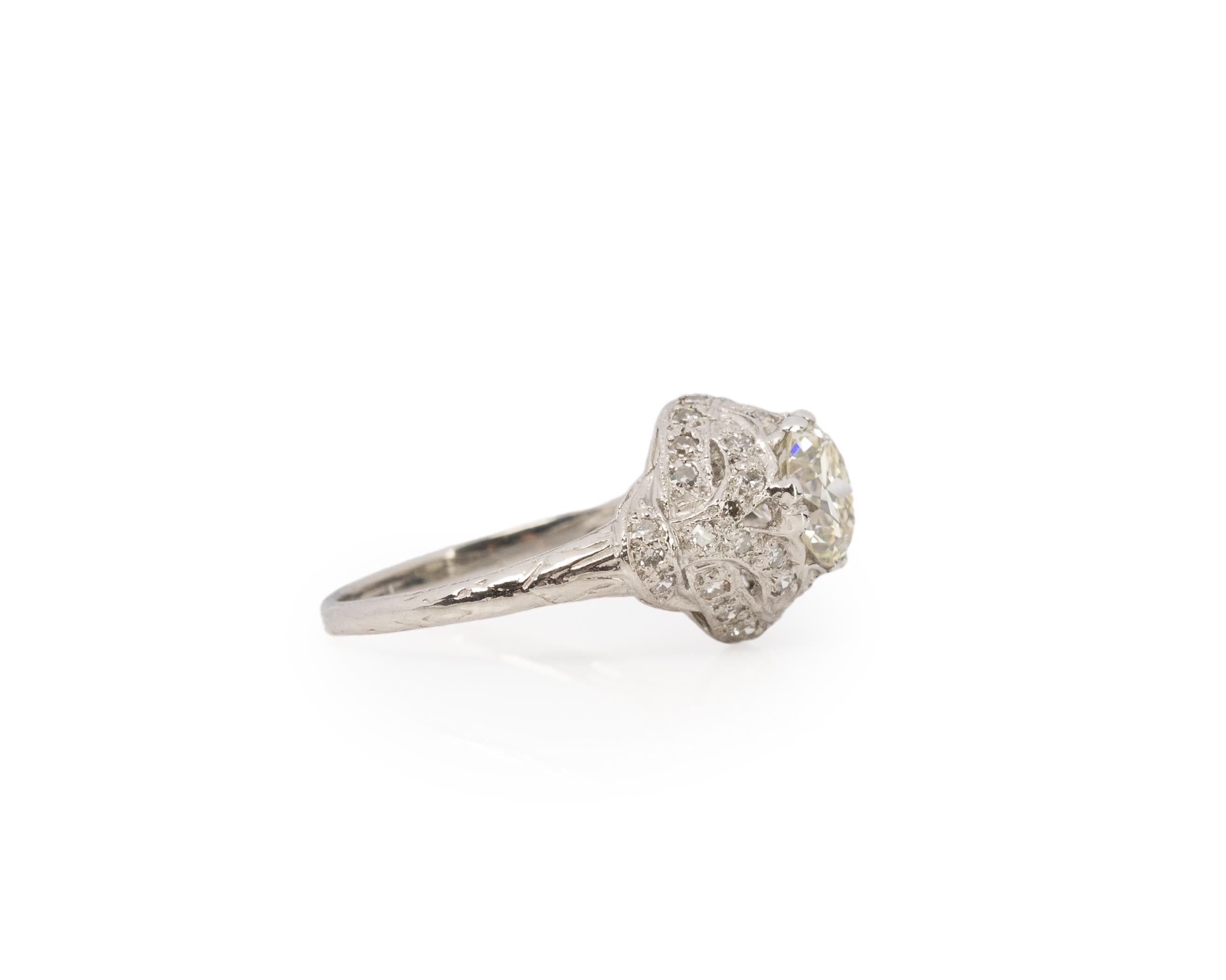 Ring Size: 7
Metal Type: Platinum [Hallmarked, and Tested]
Weight: 4.5 grams

Center Diamond Details:
GIA LAB REPORT #: 7458903834
Weight: 1.39ct
Cut: Old European brilliant
Color: N
Clarity: VS1
Measurements: 7.20mm x 6.99mm x 4.48mm

Side Diamond