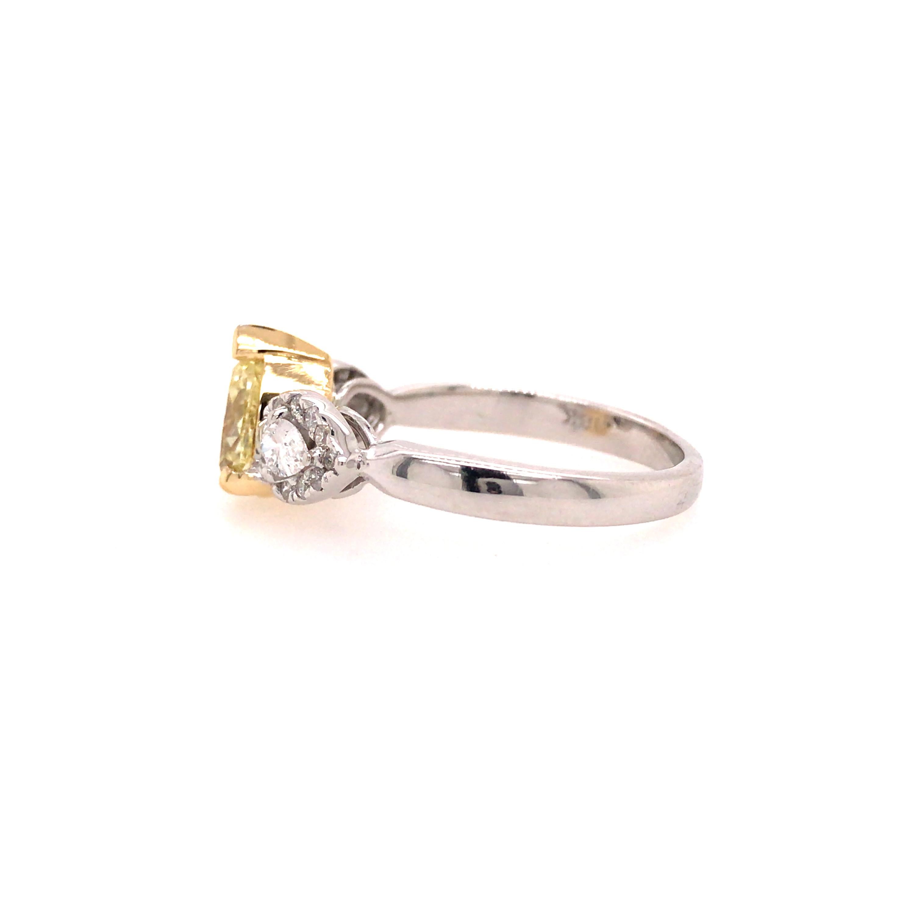 Pear Cut GIA Certified 1.39 Carat Fancy Yellow Pear Shape Diamond 3-Stone Ring 18KTT For Sale
