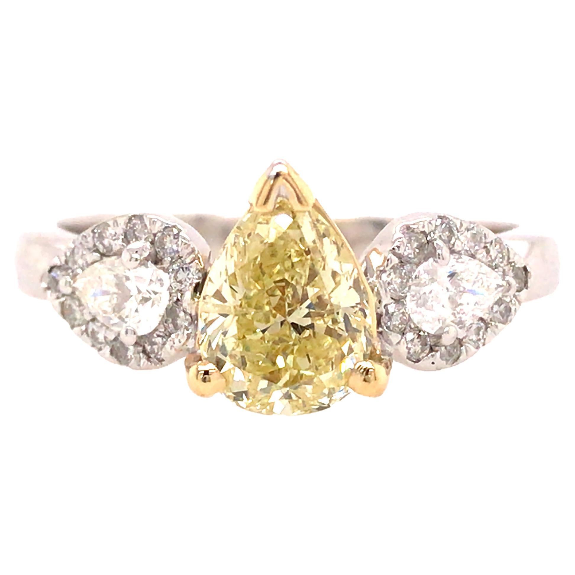 GIA Certified 1.39 Carat Fancy Yellow Pear Shape Diamond 3-Stone Ring 18KTT For Sale