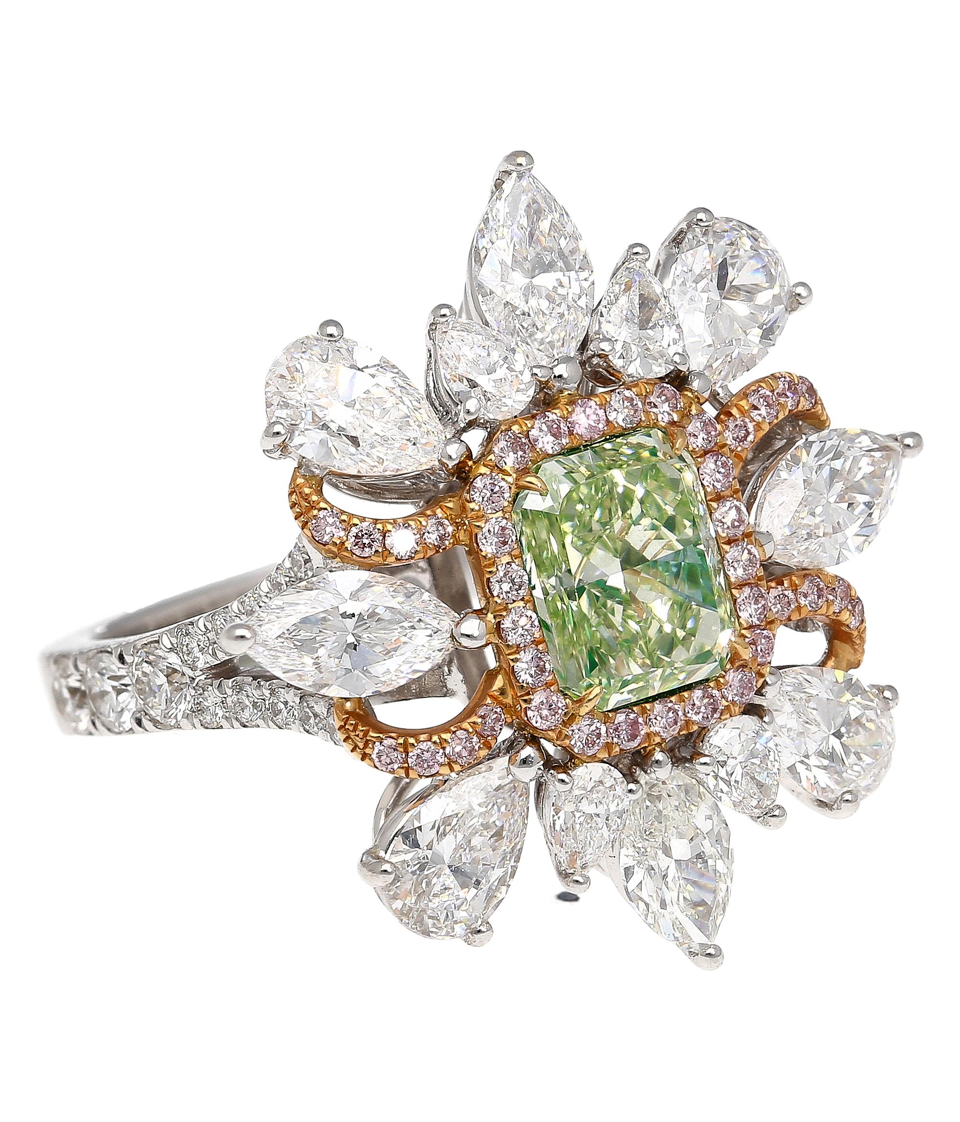 GIA Certified 1.39 carat radiant cut fancy intense yellowish green diamond ring. Adorned with 4 marquise and 8 pear cut diamonds, weighing 2.8 cttw. Bezel set center stone with 26 round diamonds (0.44cttw) and 38 round cut pink diamonds (0.19 cttw)