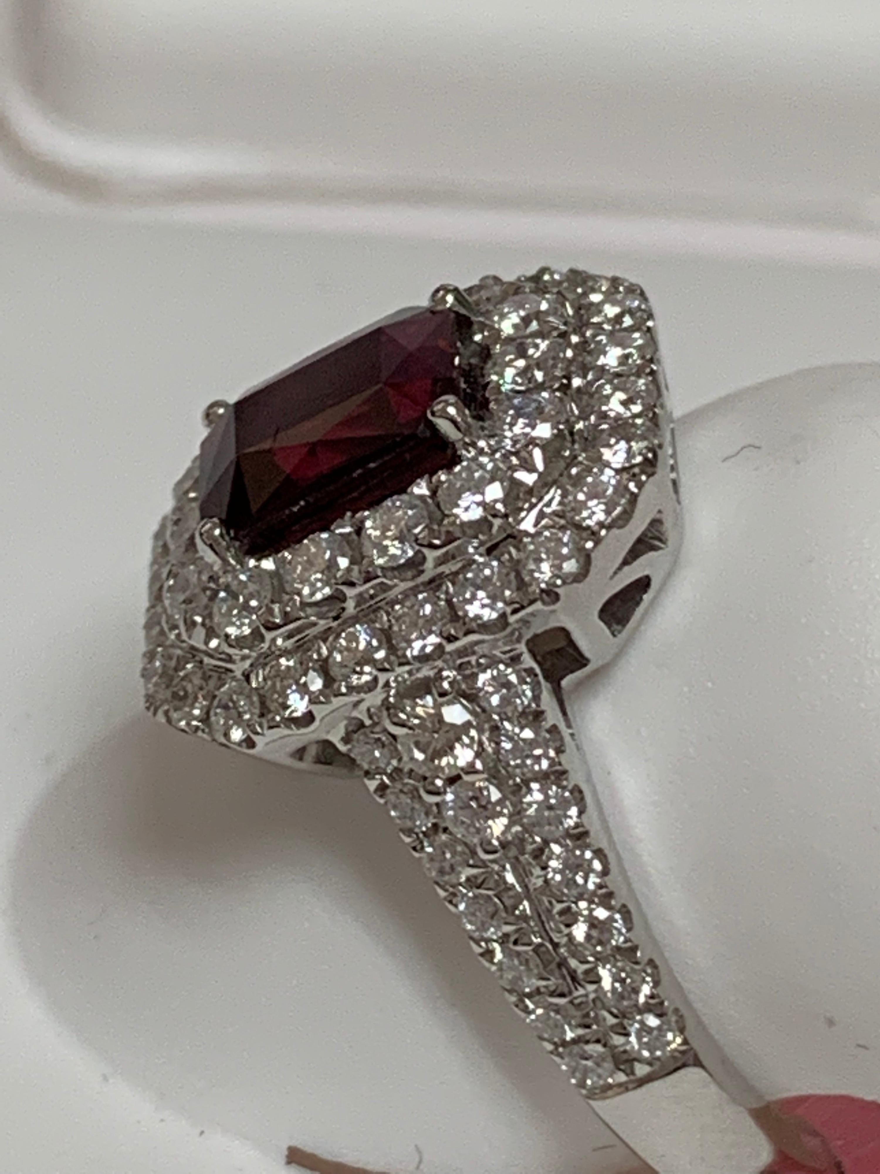 Natural GIA Certified 1.39 Carat Emerald Cut Ruby and 0.94 Carat round white diamonds set in 18  Karat white Gold. The size of the ring is 7 but can be resize if needed.
