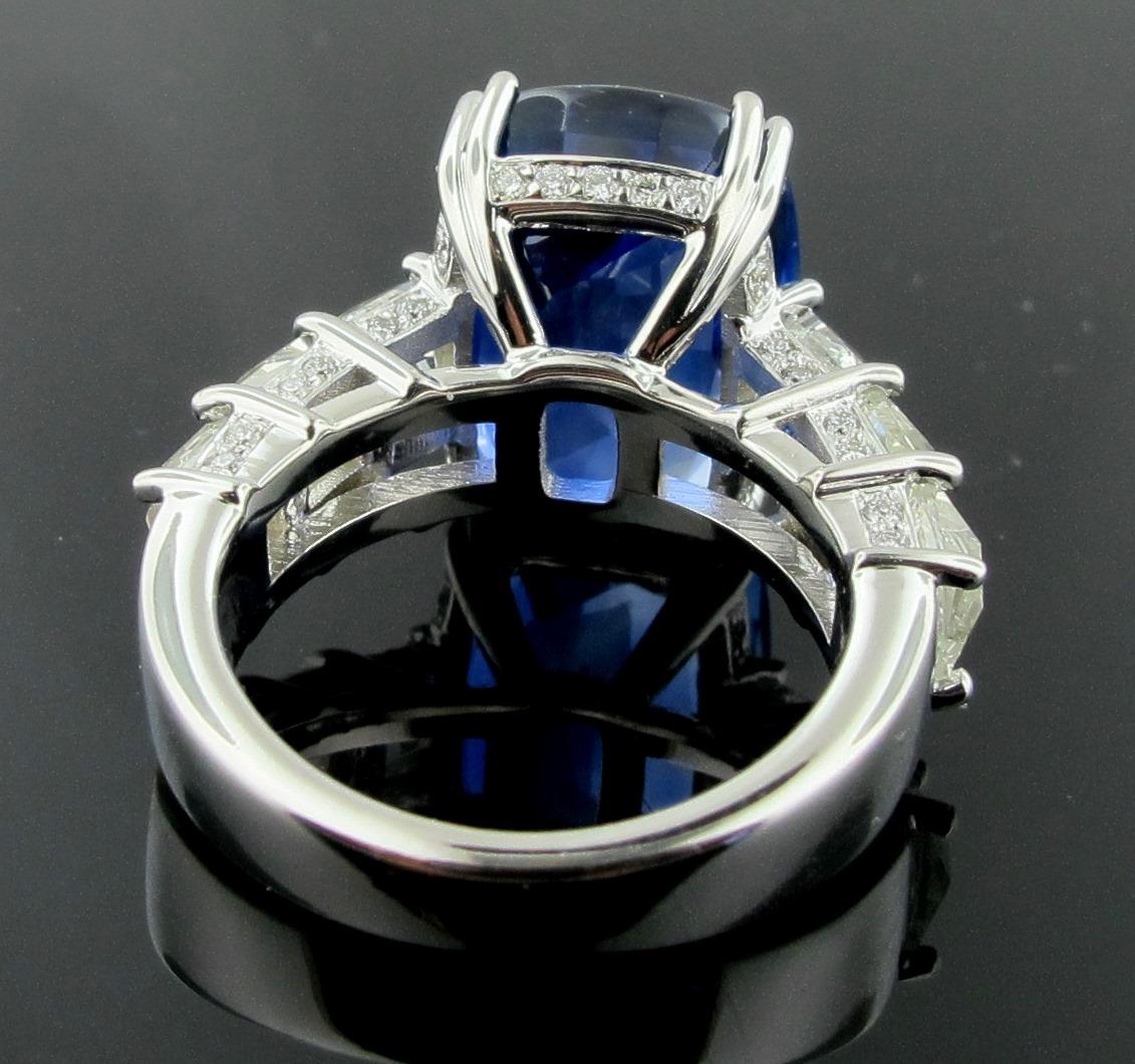 GIA Certified 13.97 Carat Burma No-Heat Blue Sapphire Ring.  Set in Platinum with 6 French Cut diamonds with a total weight of 3.45 carats, Color is G, Clarity is VS.   There are also 36 round brilliant cut diamonds with a weight of 0.23 carats. 