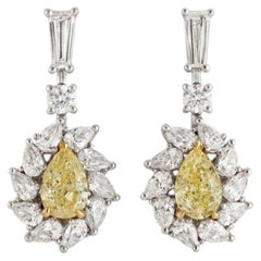 GIA Certified 1.4 Carat Fancy Yellow Pear Diamond Cluster Dangle Earrings