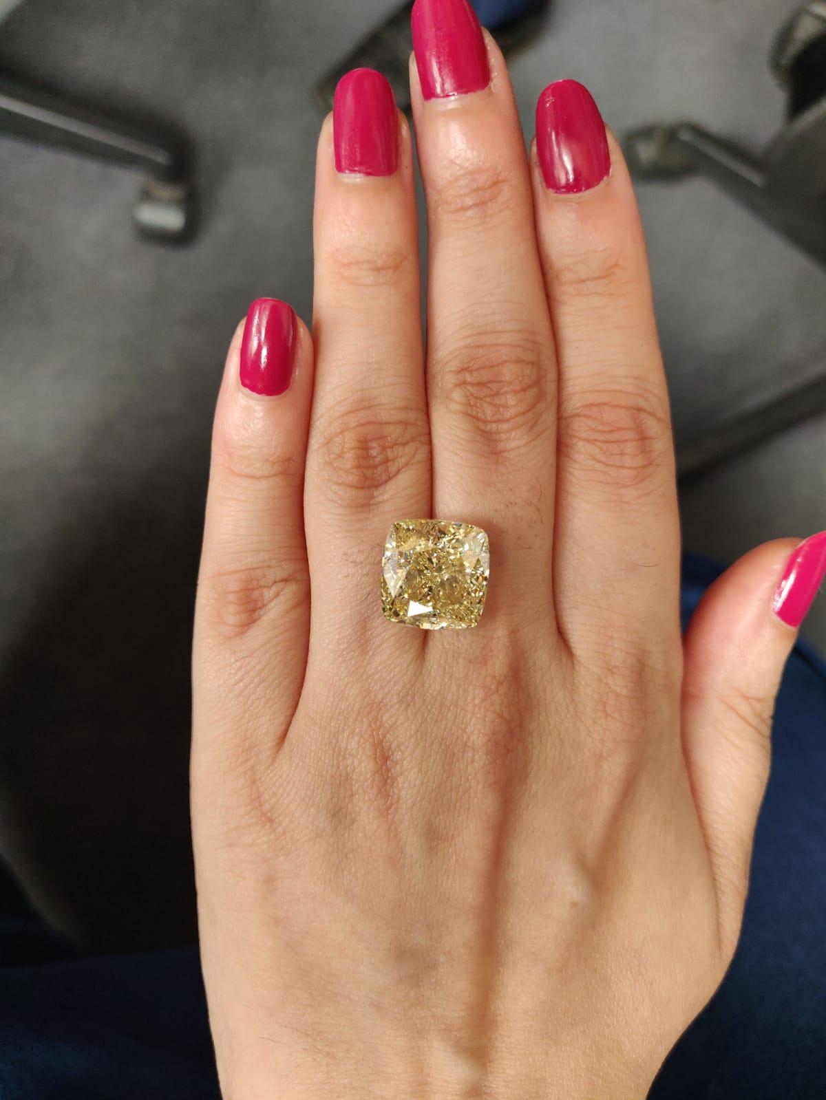 GIA Certified 14 Carat Yellow Cushion Cut Diamond 
Excellent Polish
Excellent Symmetry
None Fluorescence