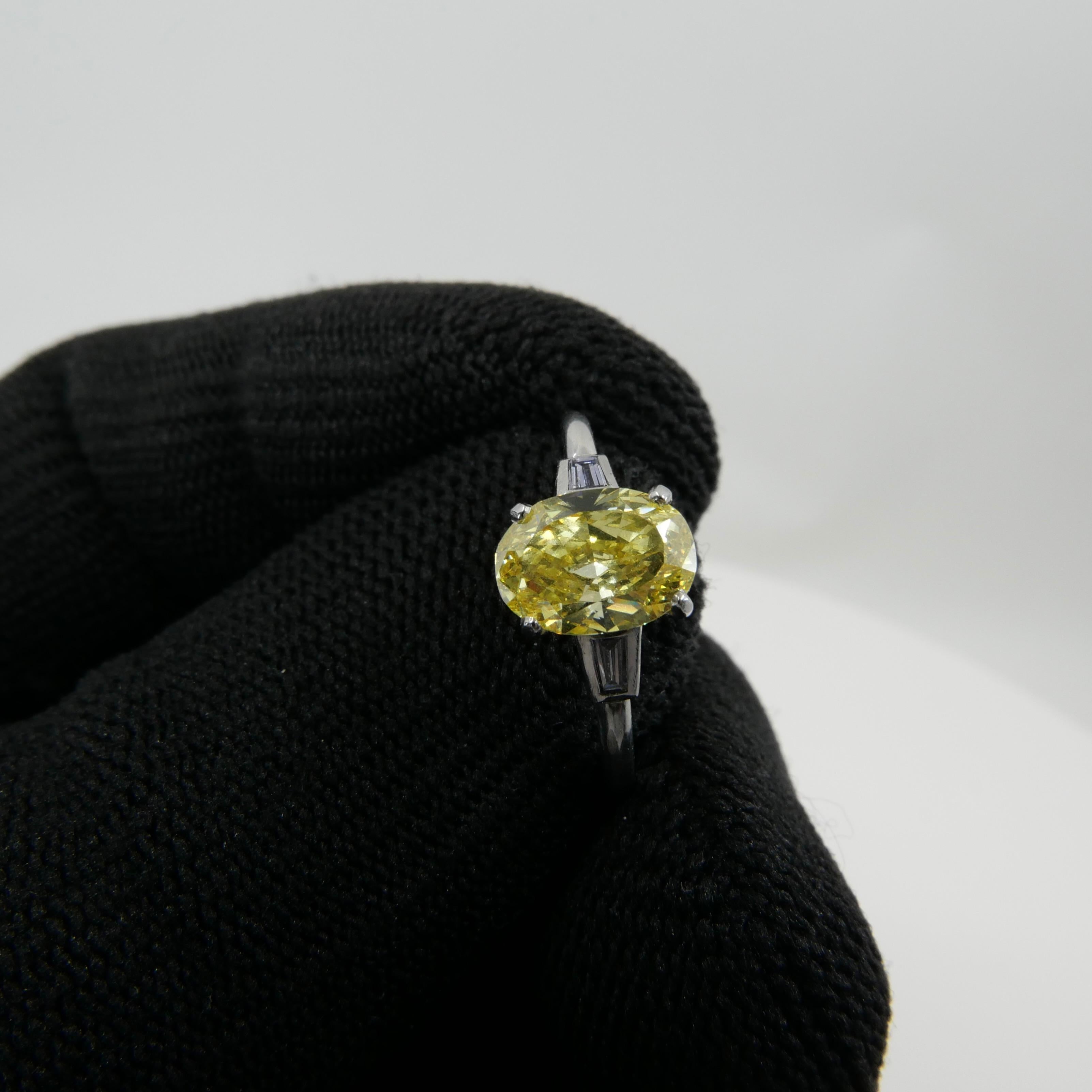 Contemporary GIA Certified 1.4 Cts Fancy Vivid Yellow Oval Diamond Ring. Strong Color.