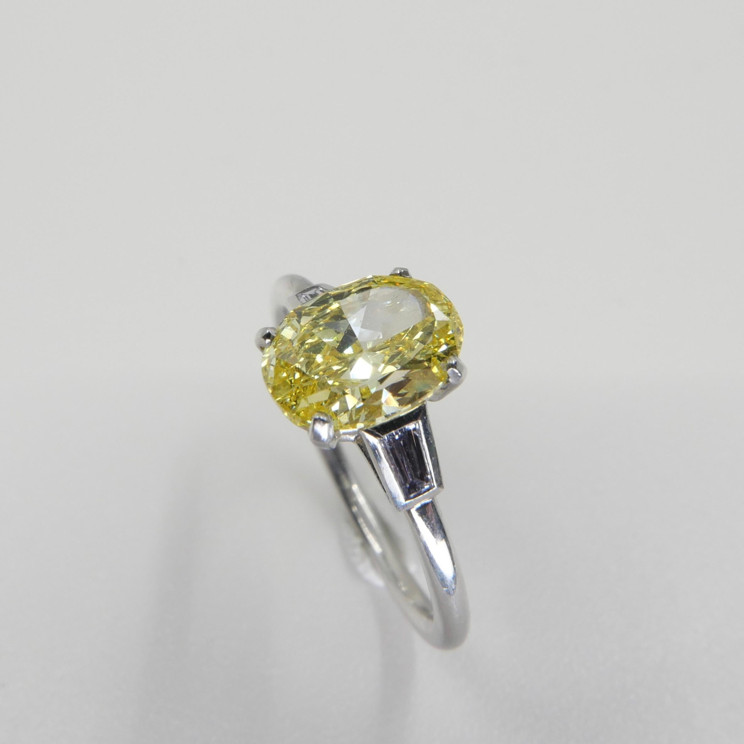 Oval Cut GIA Certified 1.4 Cts Fancy Vivid Yellow Oval Diamond Ring. Strong Color.