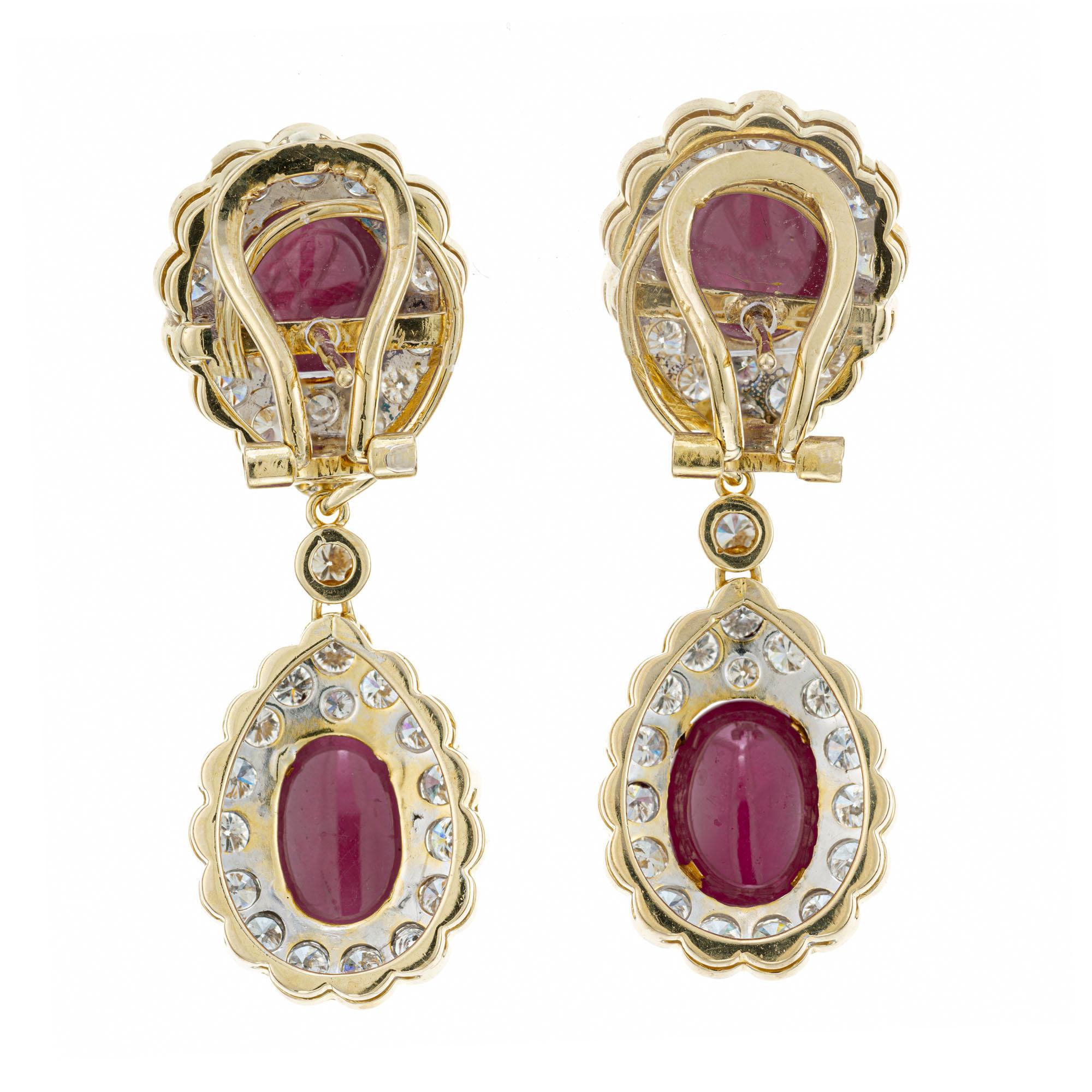 1980's Ruby and diamond day and night earrings. 4 GIA certified cabochon oval rubies with diamond halos, set in 18k yellow gold settings. 14.00 carats of bright red untreated natural no heat cabochon rubies and 3.75 carats of full cut diamonds. The