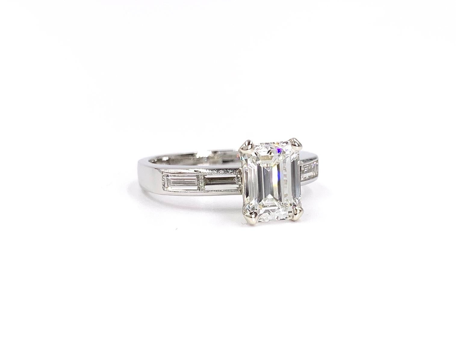 Clean and polished, this platinum channel set Jeff Cooper Designs baguette mounting features an incredible 1.41 carat emerald cut diamond certified G, VS1, No fluorescence GIA #116285701. Four well matched baguette diamonds have a total weight of