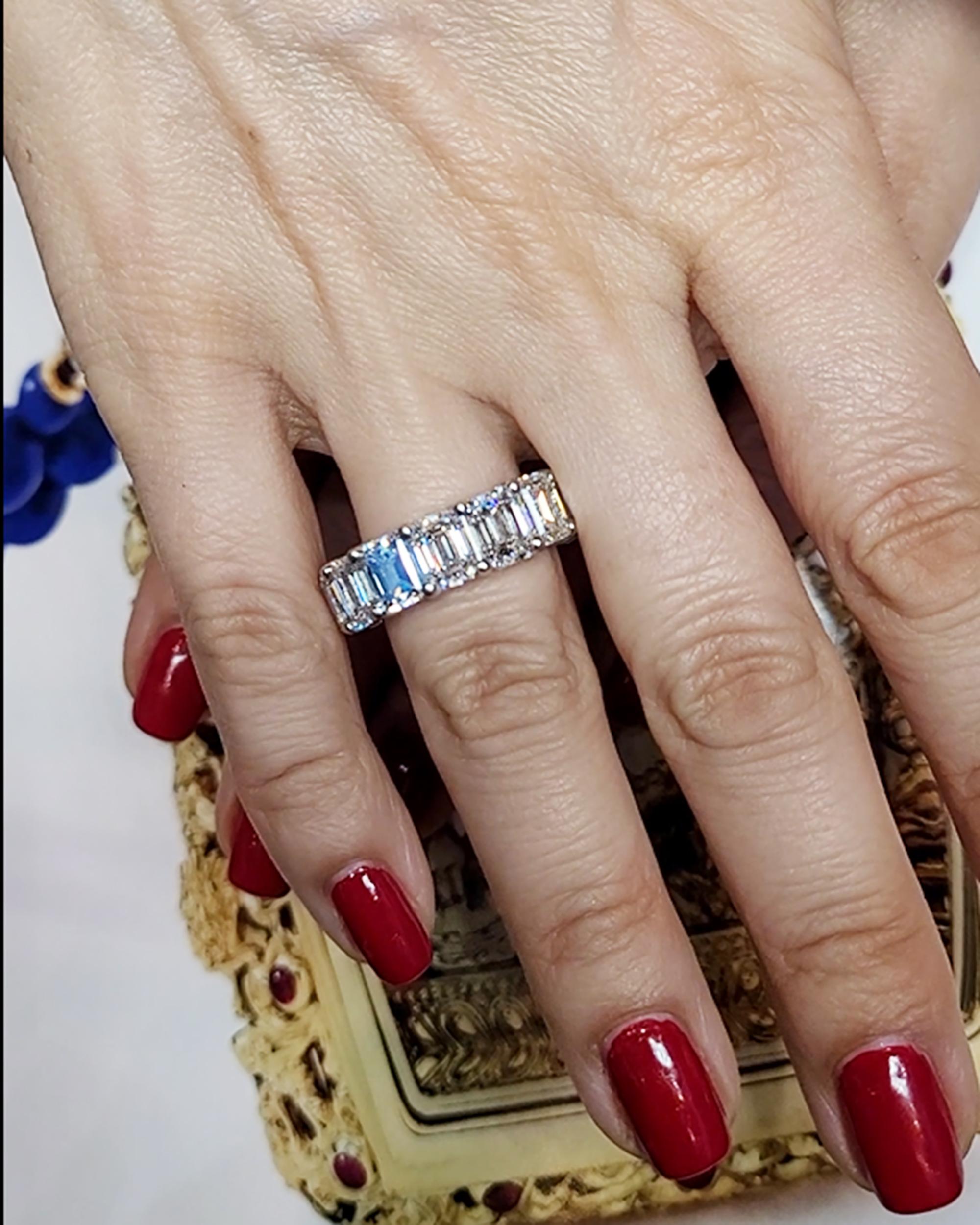 Presenting the breathtaking Spectra Fine Jewelry wedding band ring, a true embodiment of elegance and sophistication. This remarkable piece showcases 14 emerald cut diamonds weighing a total of 14.23 carats, making it a genuinely mesmerizing