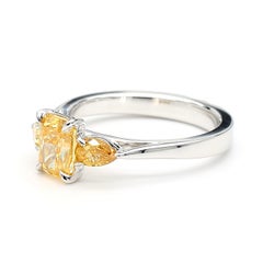 GIA Certified 1.43 Carat Intense Yellow-Orange Diamond Three Stone Ring Platinum
