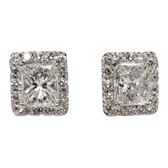 GIA Certified 1.45cts. Total Weight Diamond Stud Earrings with a Halo Set in 14k