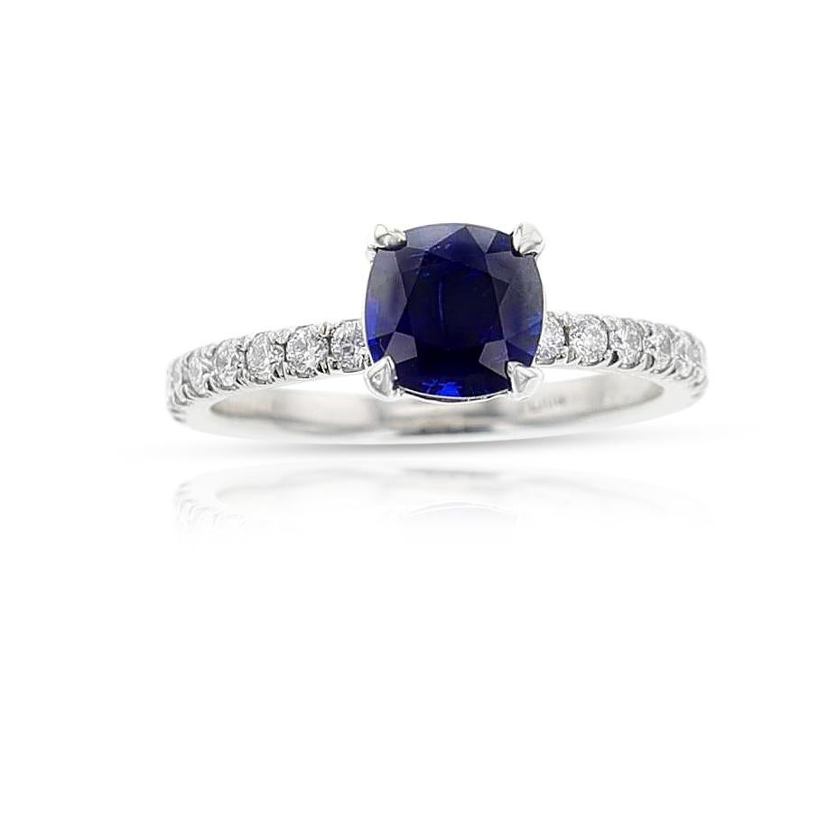A GIA Certified 1.46 ct. Unheated Burma Sapphire Ring made in Platinum. The total diamond weight is 0.35 carats, F-VS. The total weight of the ring is 4.10 grams. Ring size US 6.25.