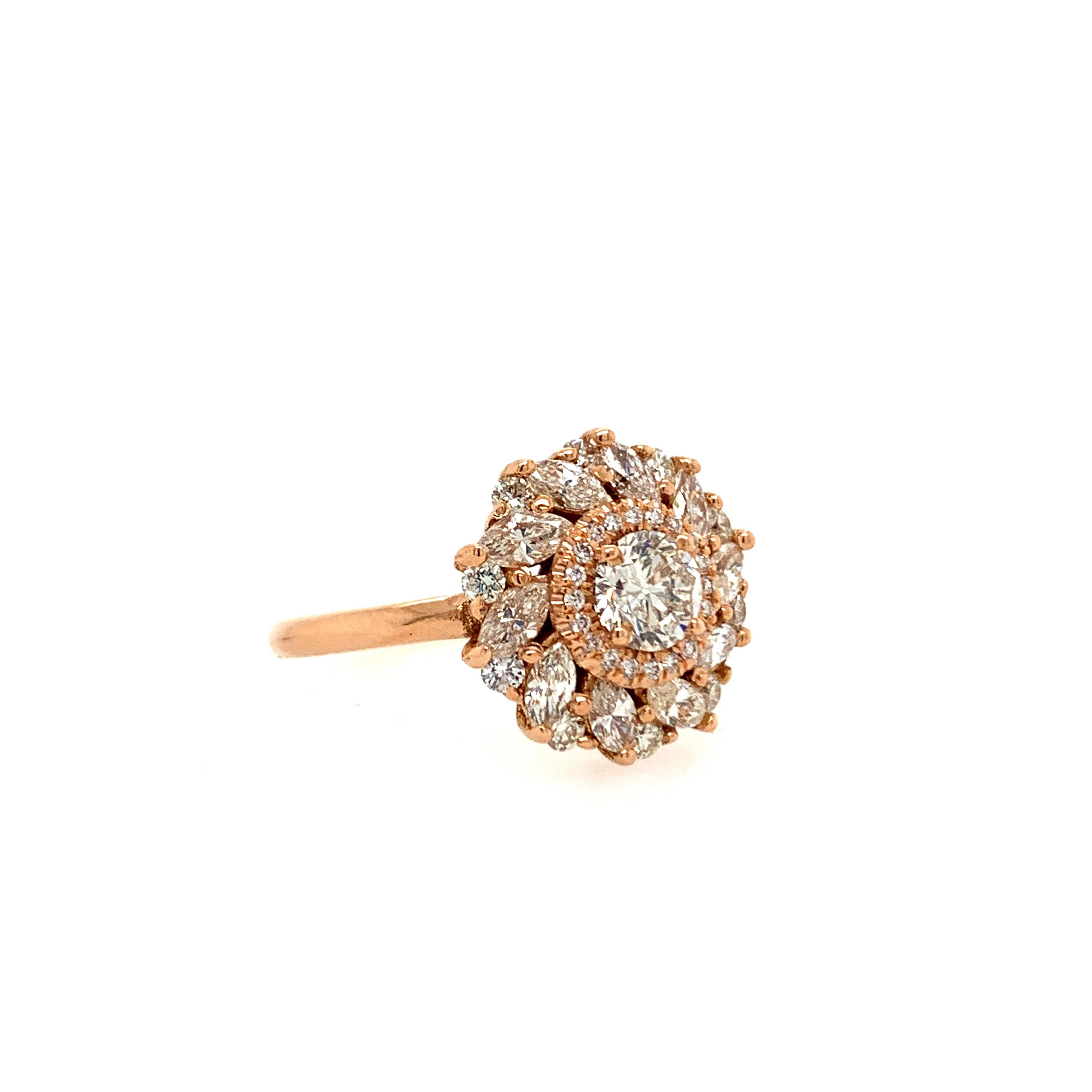 This beautiful ring flaunts a 1.48 carat round natural white diamond surrounded by a diamond halo and set atop a bed of round and marquise diamonds.

Set in 14K rose gold.

Center stone: Natural white diamond - 0.40 carat, color G, clarity SI1
