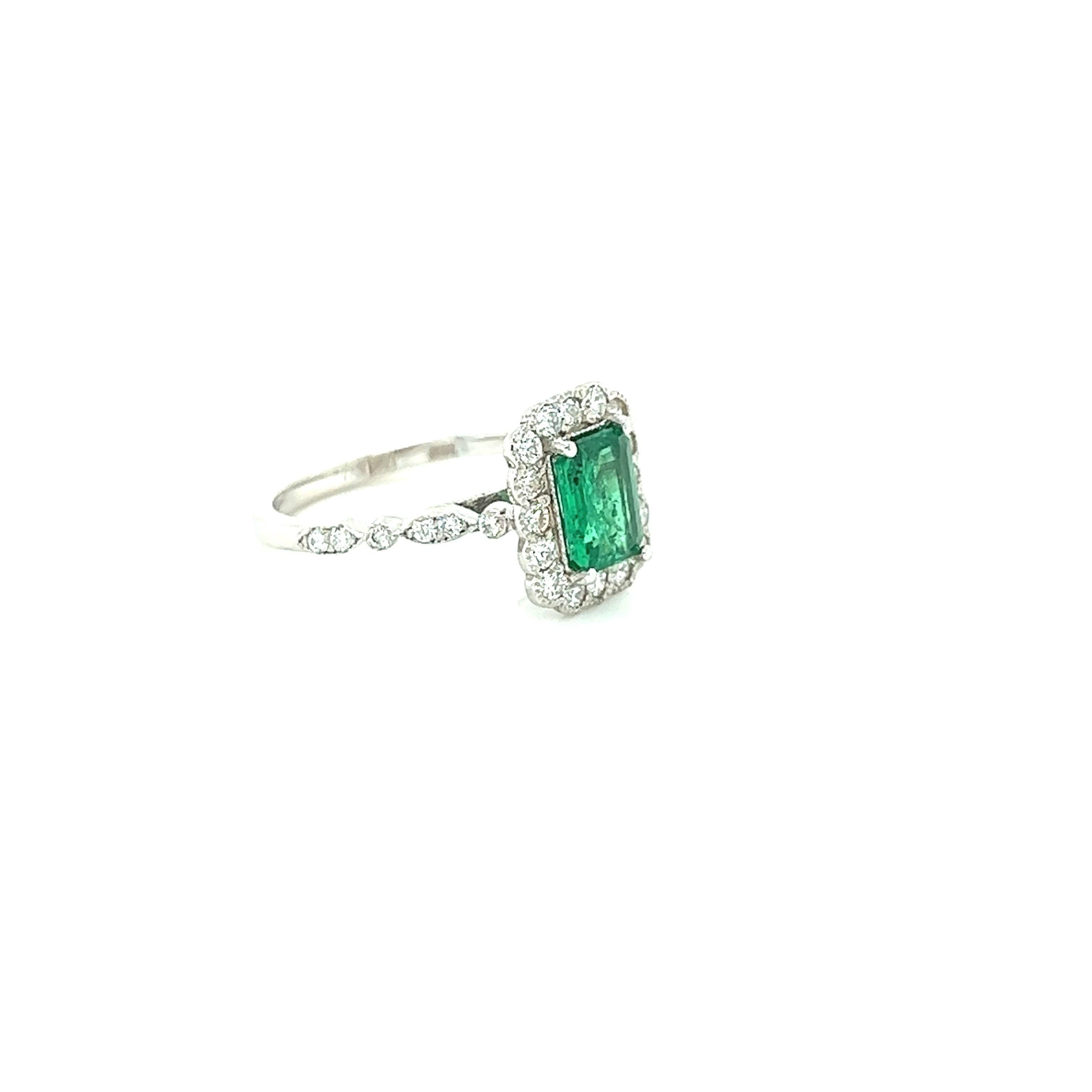 A beautiful & classic setting holding a Natural Emerald Cut Emerald that weighs 0.95 carats and is surrounded by 28 Round Cut Diamonds that weigh 0.54 carats with a clarity & color of SI1-F.  The total carat weight of the ring is 1.49 carats.

The