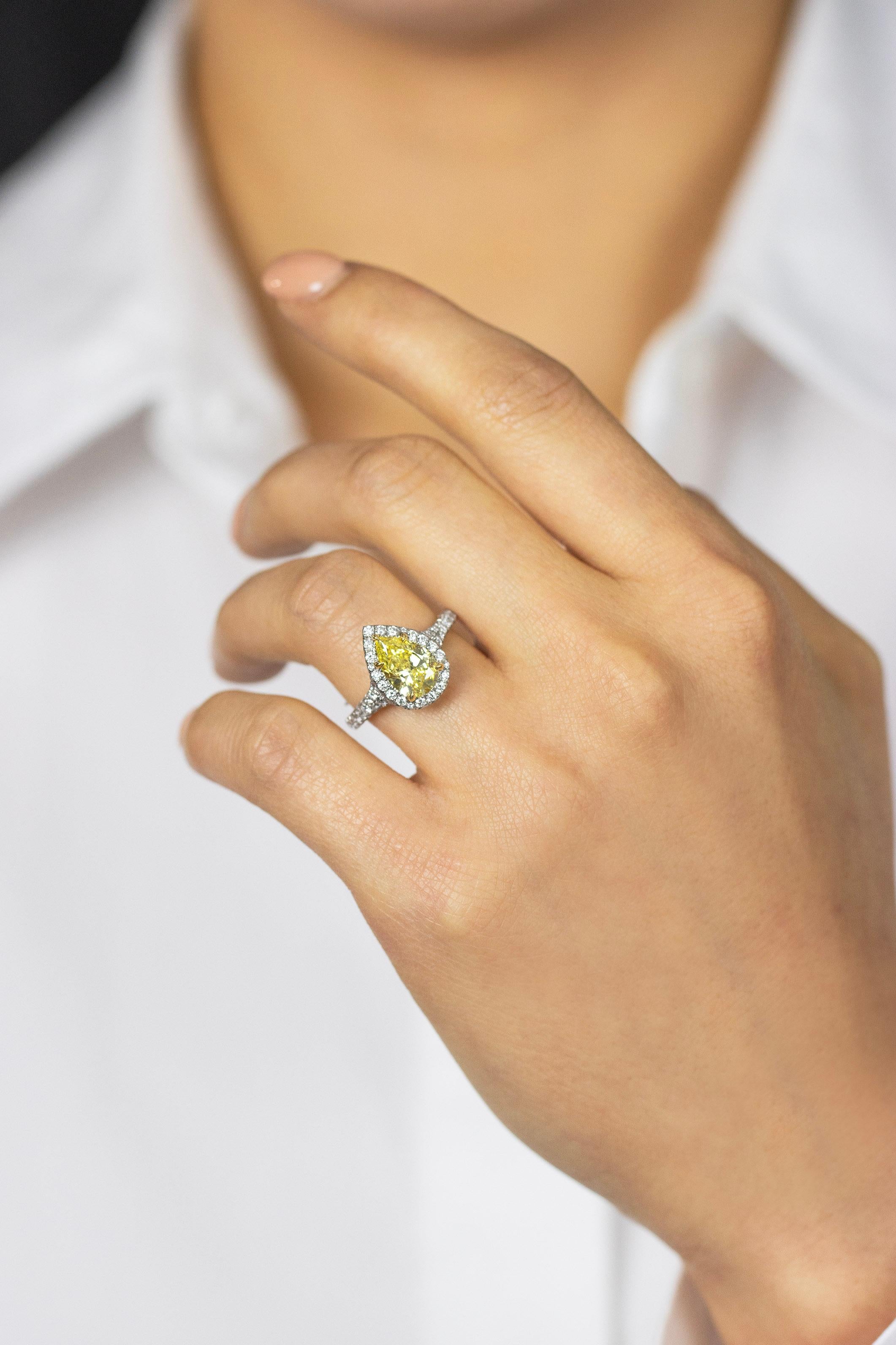 GIA Certified 1.49 Carats Fancy Intense Yellow Diamond Halo Engagement Ring In New Condition For Sale In New York, NY
