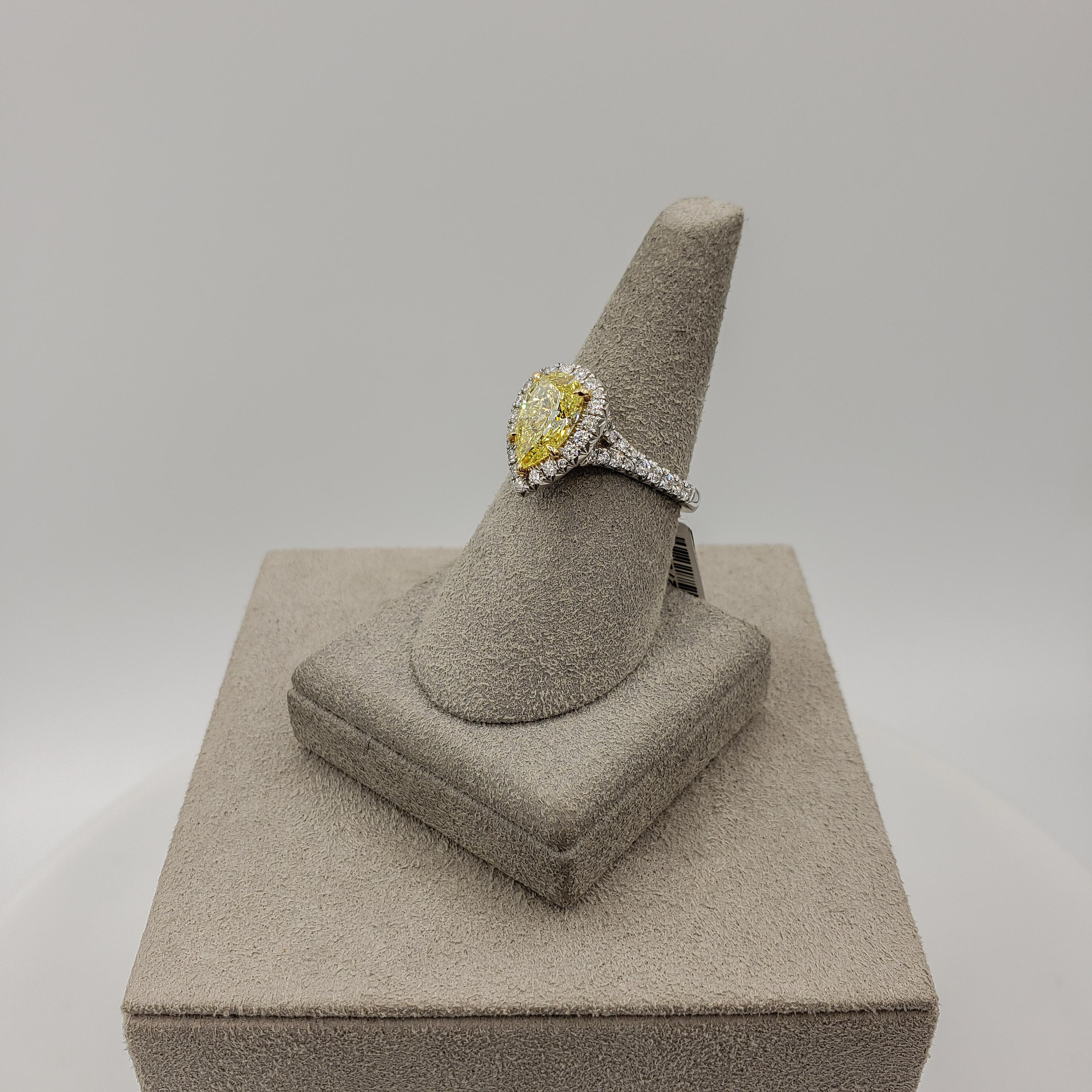 Women's GIA Certified 1.49 Carats Fancy Intense Yellow Diamond Halo Engagement Ring For Sale