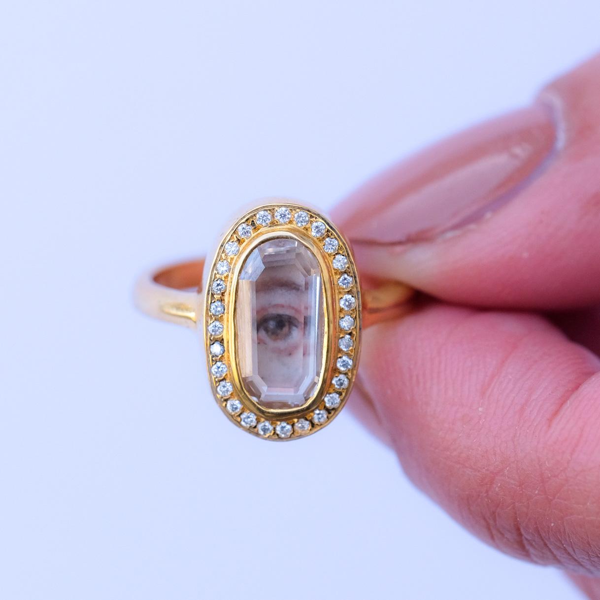 1.49 ct GIA certified portrait diamond over a custom enamelled miniature eye with .50 ct 1.7mm Vs1 round brilliants in 18k Yellow gold.

The eye in this ring is customizable, with a 8-10 week turnaround. 





Report number: 5211281102

