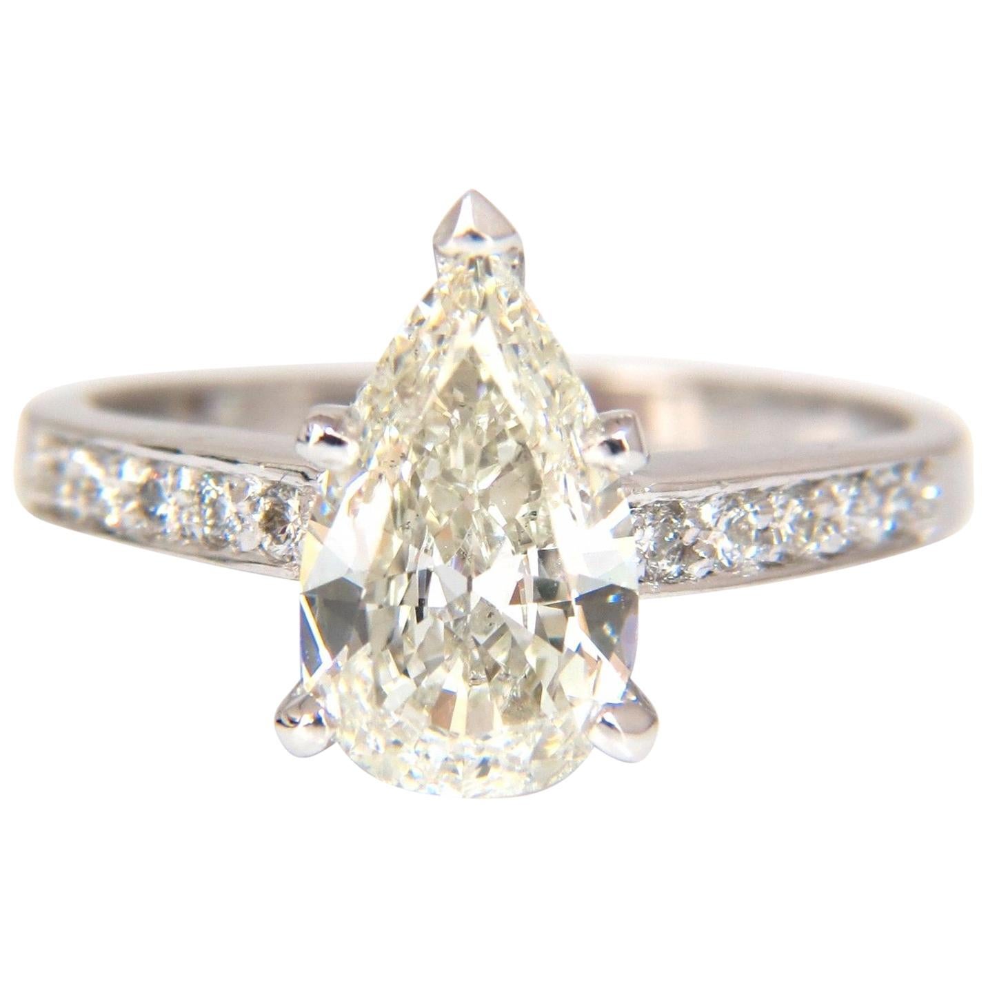 GIA Certified 1.49ct Pear Shape diamond ring .20ct. round accents 14kt For Sale