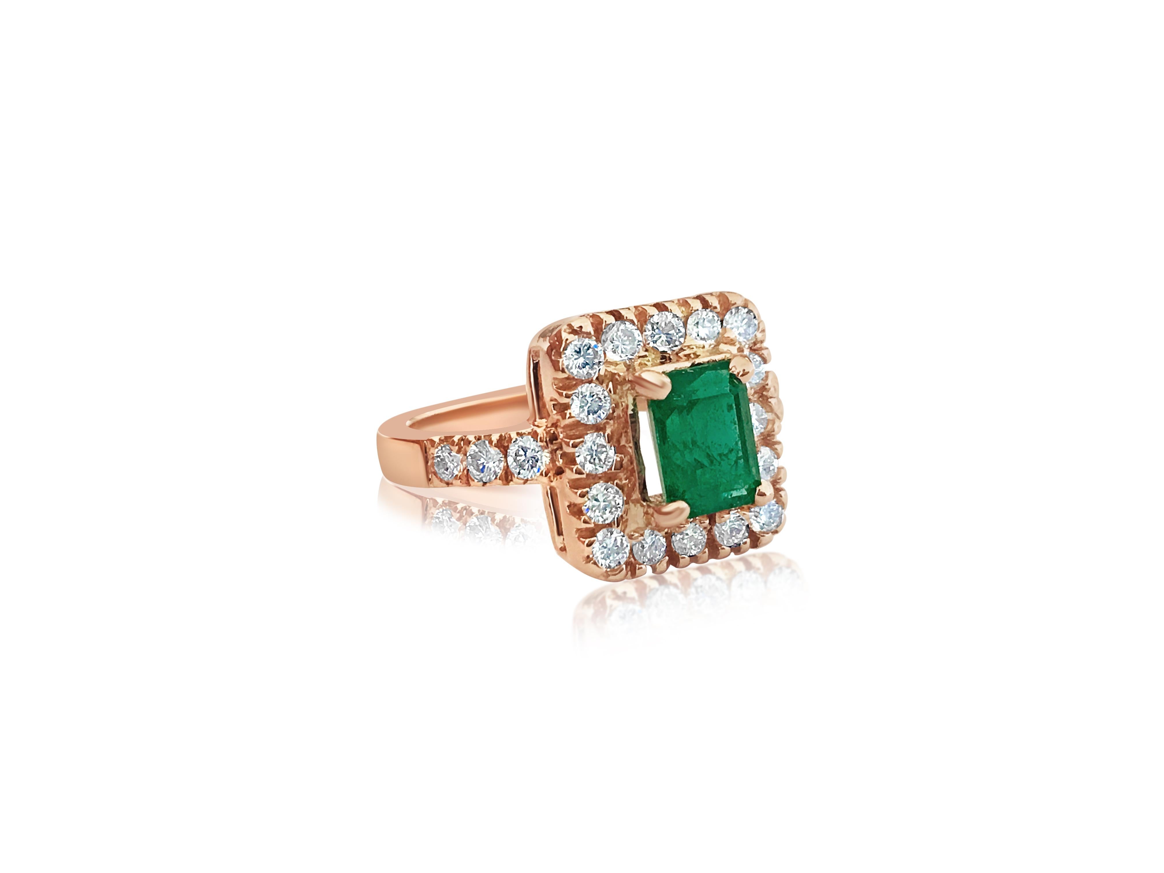 Indulge in sophistication with this custom-made ladies' ring crafted from 14K rose gold, featuring a stunning 1.00 carat emerald in a prong setting, complemented by 0.788 carats of round brilliant-cut diamonds with VS clarity and G color. Each