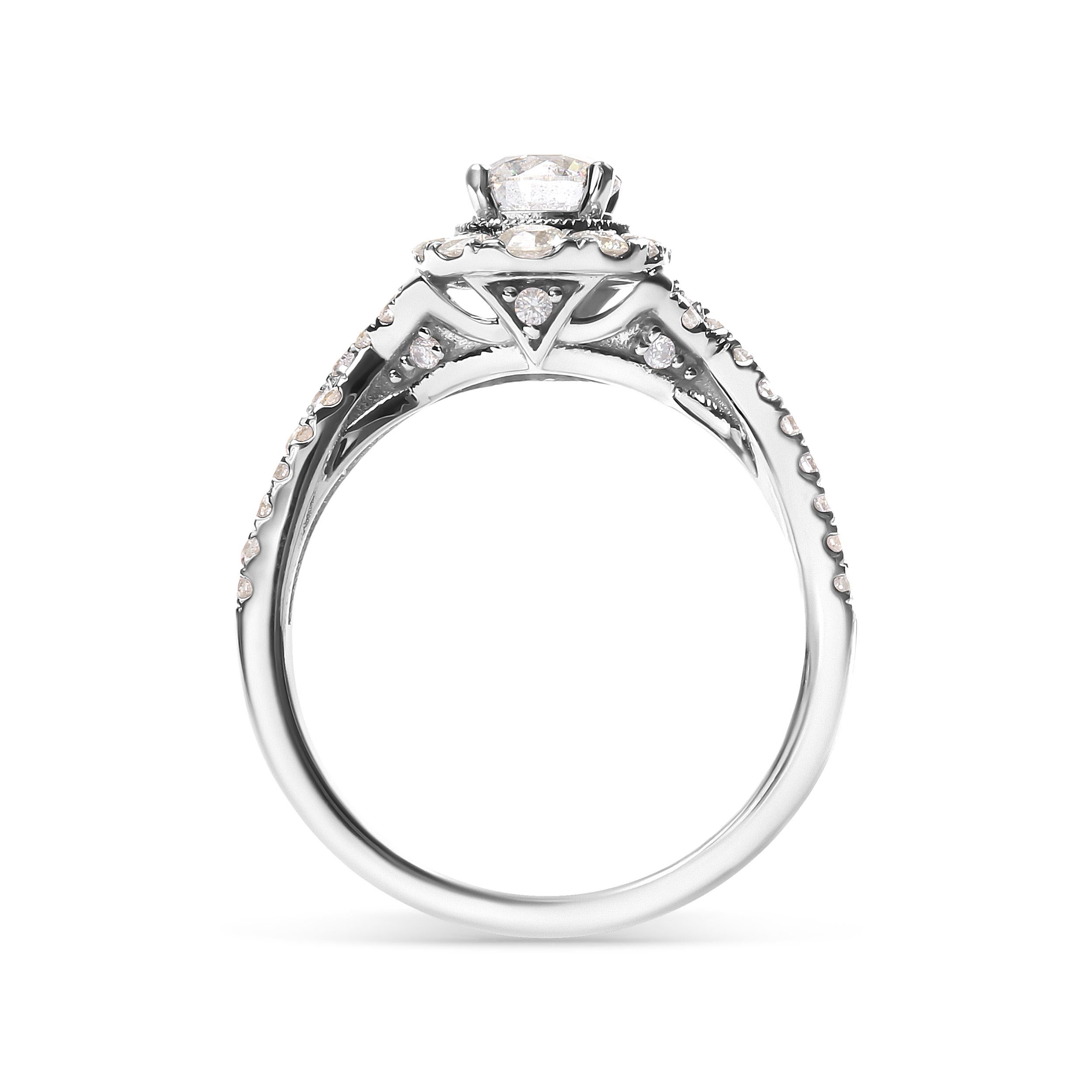 Gönnen Sie sich das ultimative Symbol der Liebe mit diesem atemberaubenden Verlobungsring. Dieser Ring aus 14-karätigem Weißgold ist mit einem runden 1/2-Karat-Diamanten besetzt, der von GIA für Qualität und Brillanz zertifiziert wurde. Der